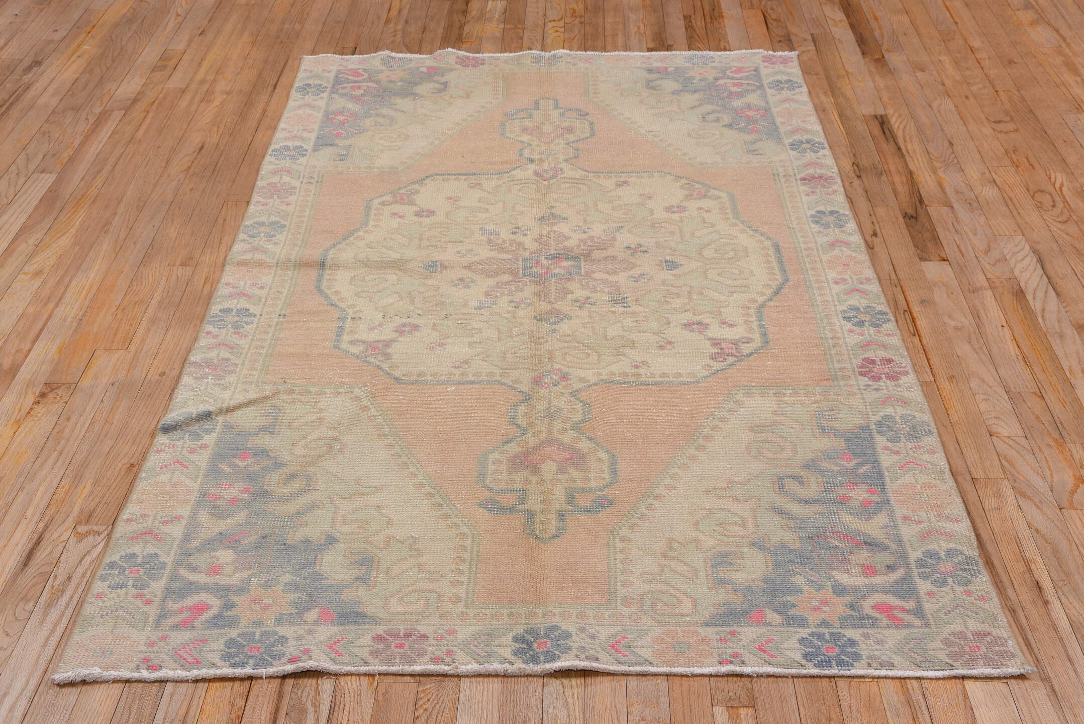 4' x 7' one-of-a-kind handmade vintage Oushak rug. Color palette: peach, ivory, taupe, slate, rose, beige, terracotta, pink