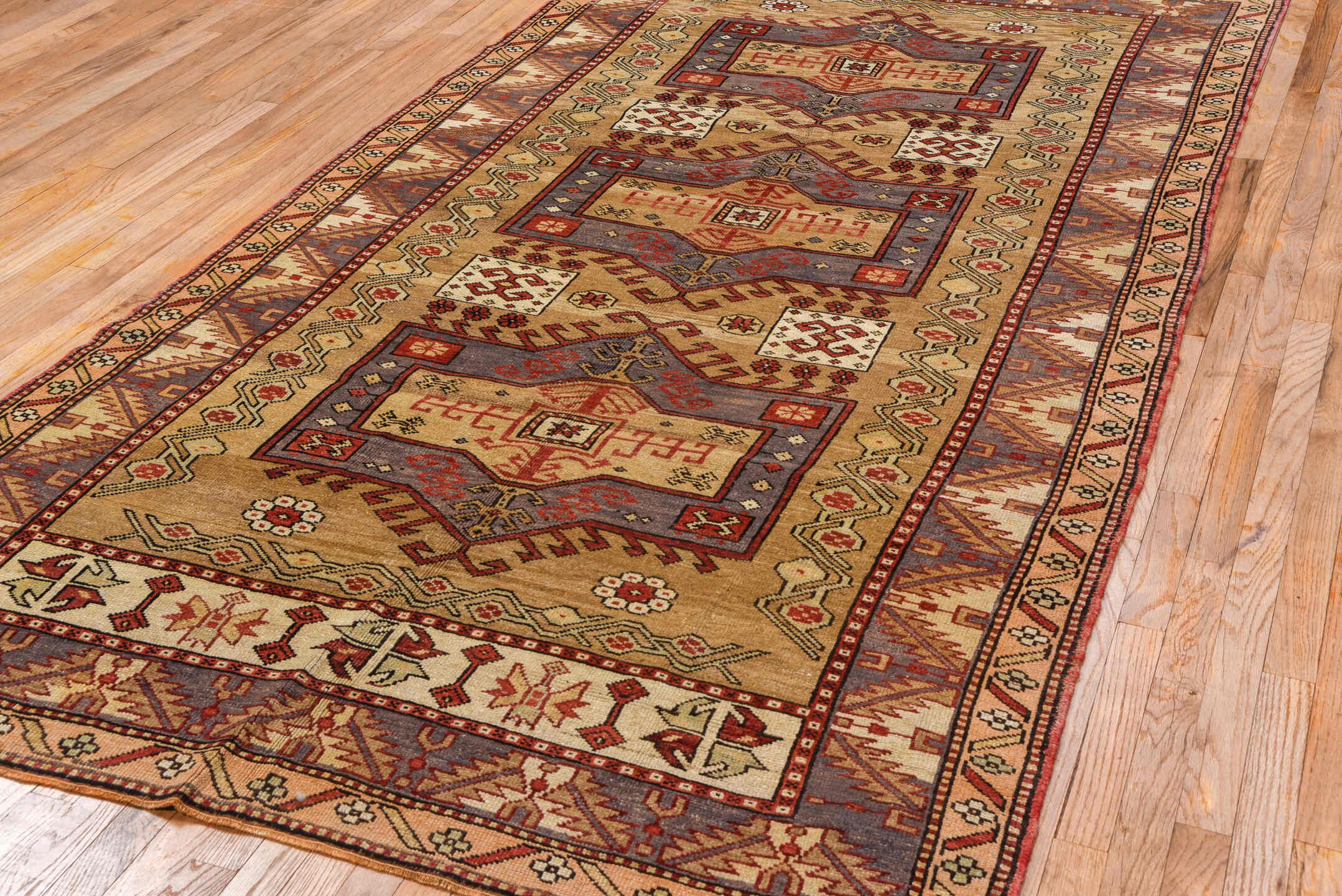 5' x 10' one-of-a-kind handmade vintage Kars medium size rug. Color palette: tan, rust, ivory, lavender, brick, taupe