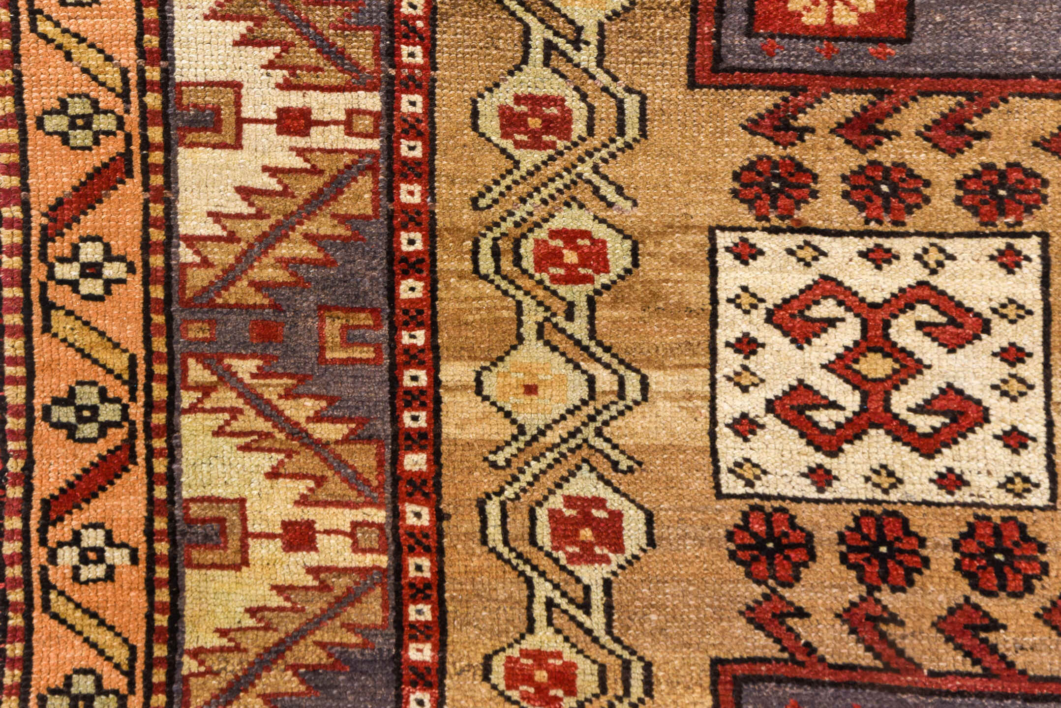 5' x 10' one-of-a-kind handmade vintage Kars medium size rug. Color palette: brown, gray, off-white, orange, pink, red