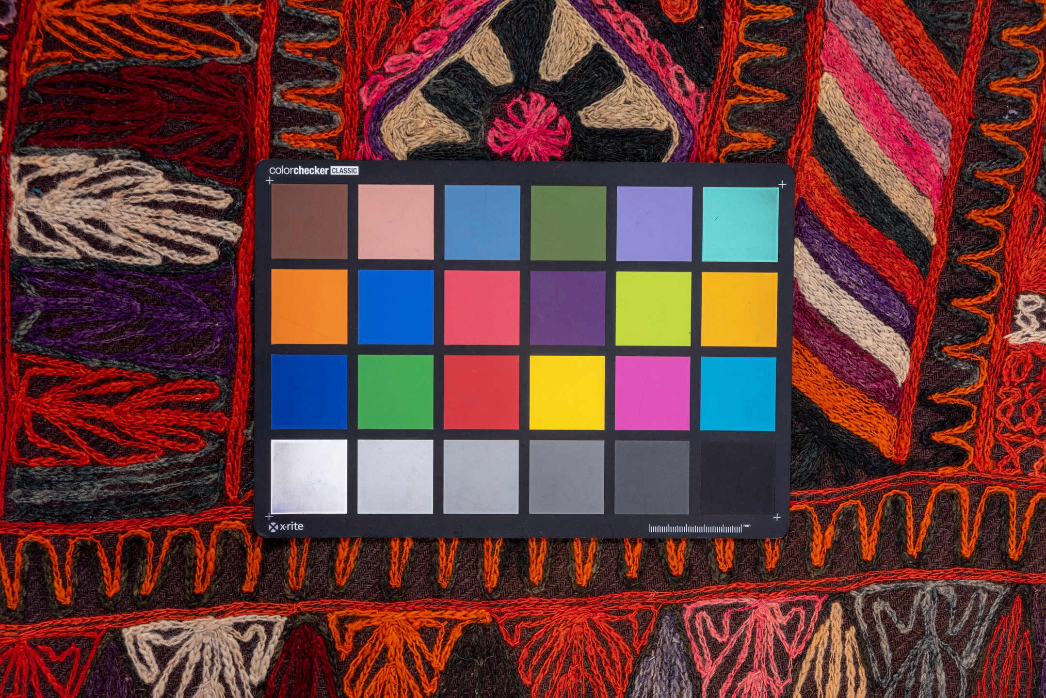 2' x 6' one-of-a-kind handmade vintage Kilim runner rug. Color palette: burgundy, rust, charcoal, violet, ivory, rose