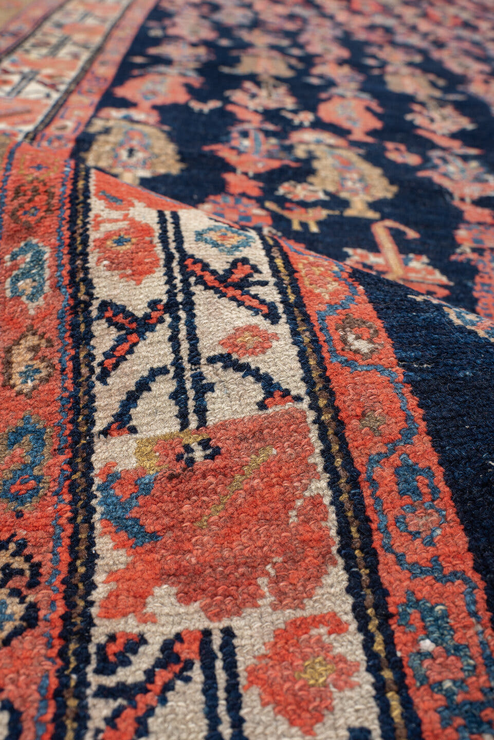4' x 11' one-of-a-kind handmade vintage Malayer runner rug. Color palette: brown, rust, ivory, navy, coral, gold, camel