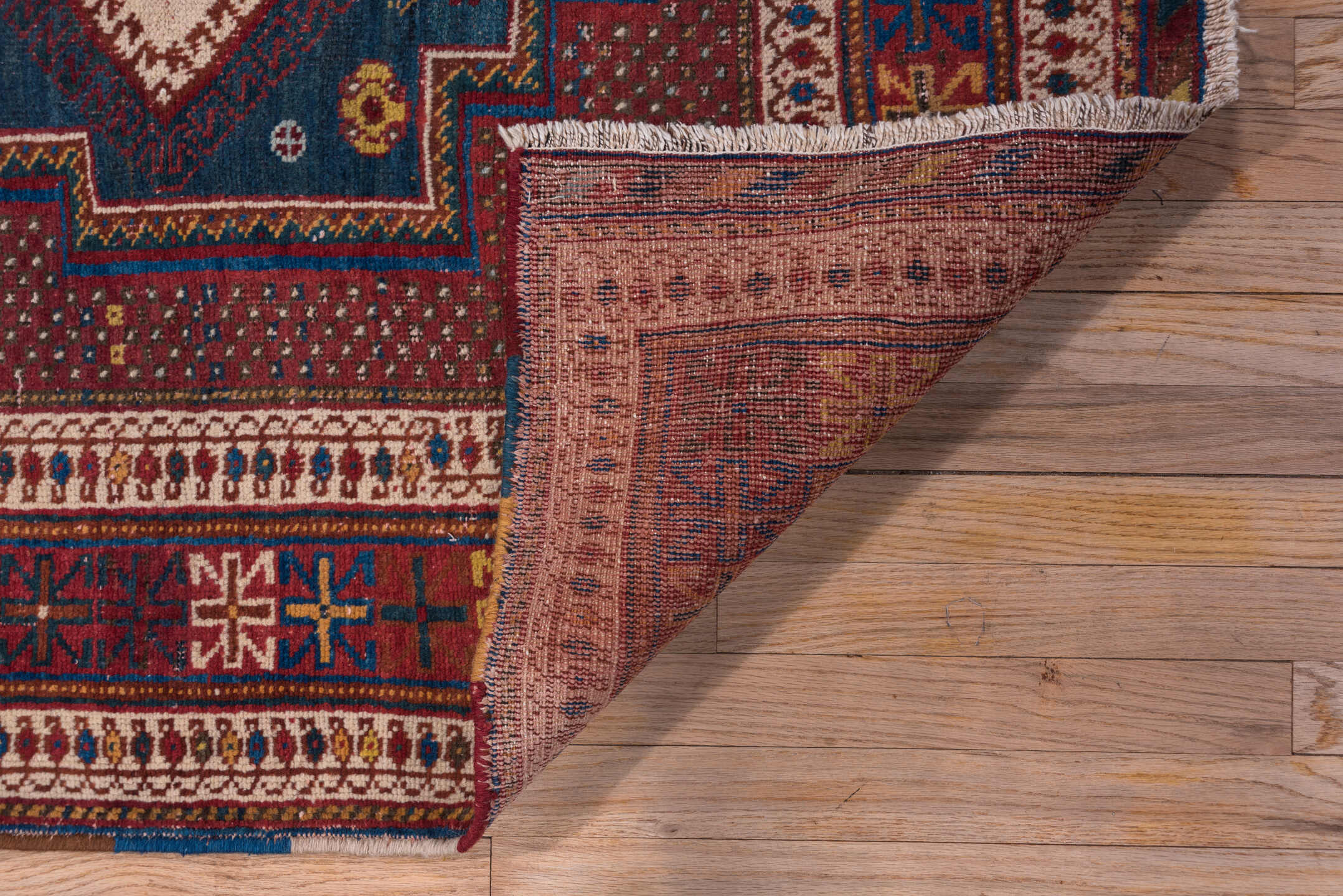 4' x 5' one-of-a-kind handmade antique Afshar small size rug. Color palette: rust, indigo, ivory, burgundy, camel, gold