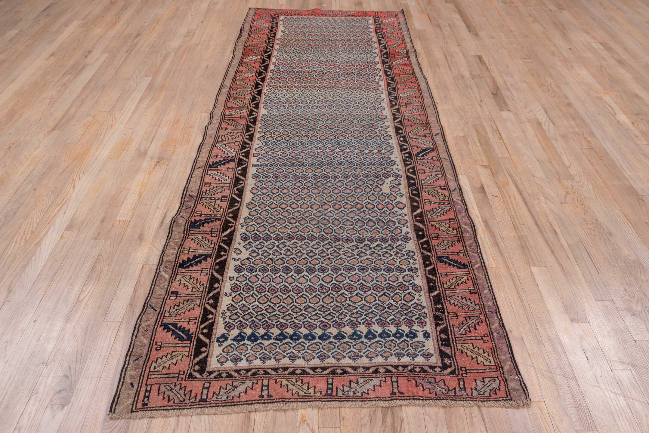 4' x 10' one-of-a-kind handmade antique Malayer runner rug. Color palette: ivory, rust, navy, rose, charcoal, taupe