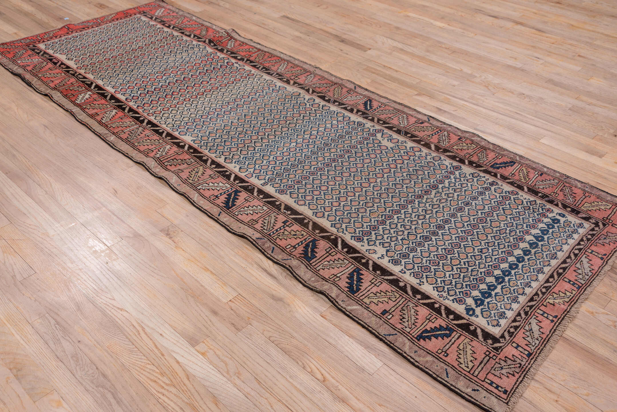 4' x 10' one-of-a-kind handmade antique Malayer runner rug. Color palette: ivory, rust, navy, rose, charcoal, taupe