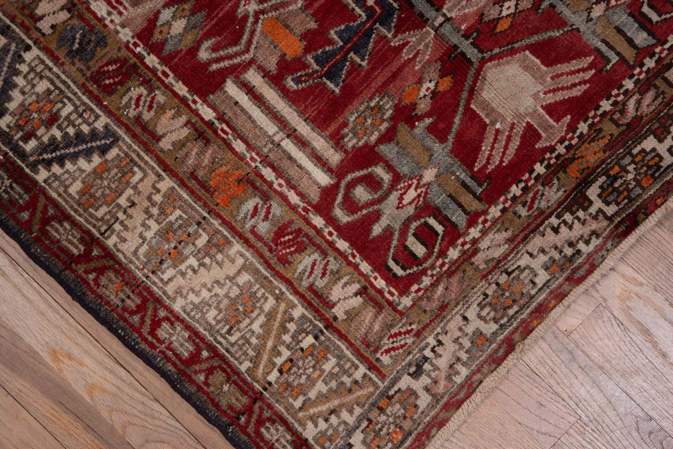 3' x 10' one-of-a-kind handmade vintage Heriz runner rug. Color palette: brick red, ivory, rose, rust, taupe, navy, orange