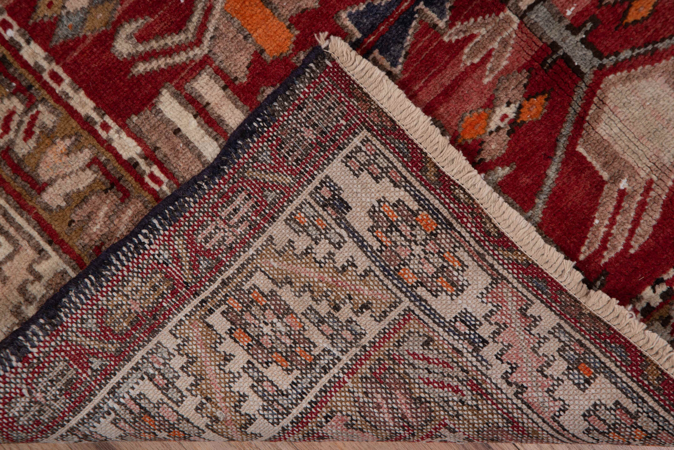 3' x 10' one-of-a-kind handmade vintage Heriz runner rug. Color palette: brick red, ivory, rose, rust, taupe, navy, orange