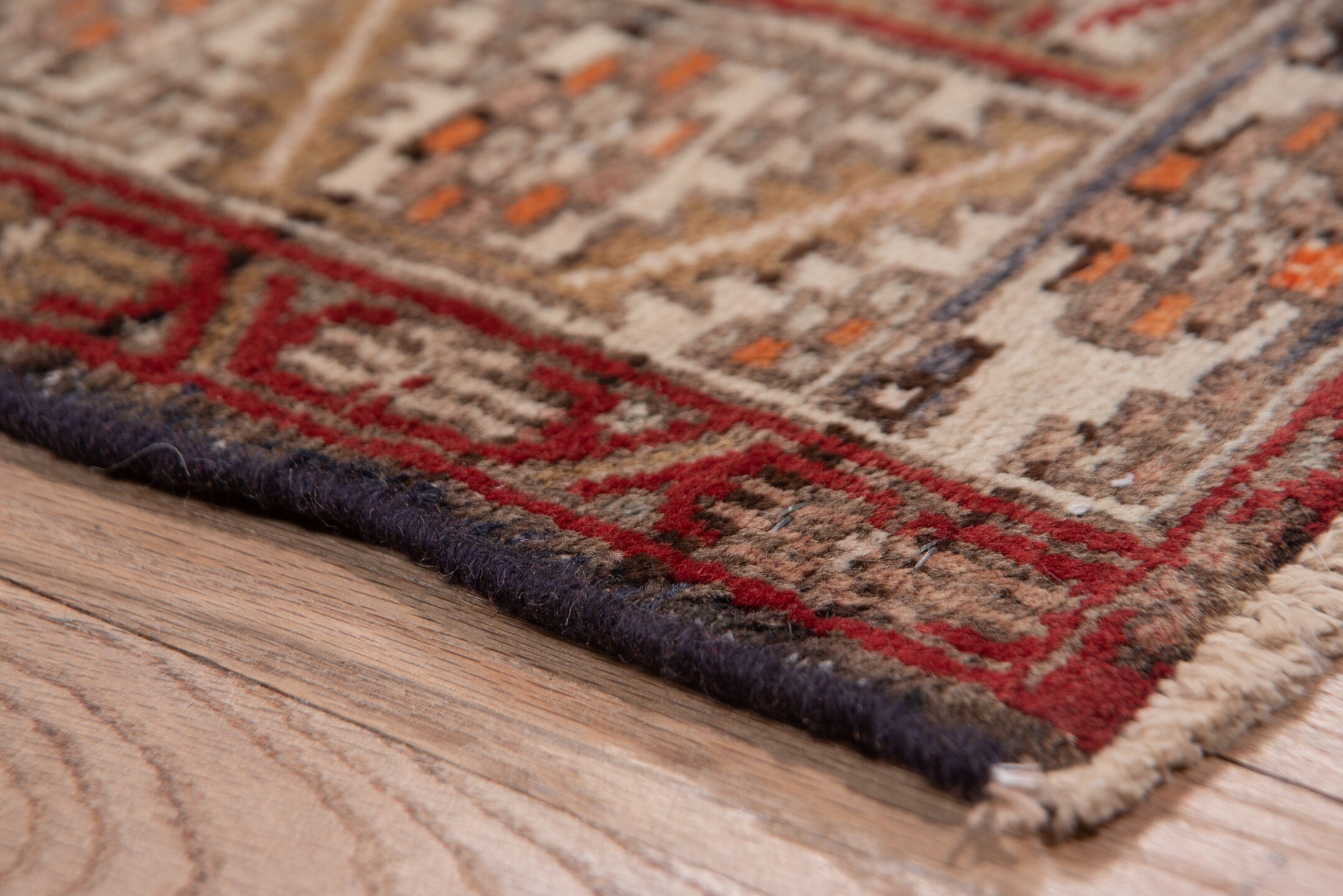 3' x 10' one-of-a-kind handmade vintage Heriz runner rug. Color palette: brick red, ivory, rose, rust, taupe, navy, orange