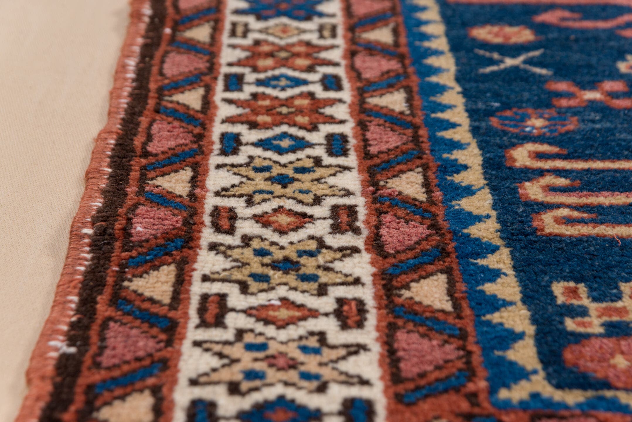 3' x 4' one-of-a-kind handmade antique Karaje small size rug. Color palette: navy, ivory, rust, cobalt, rose, camel, brown