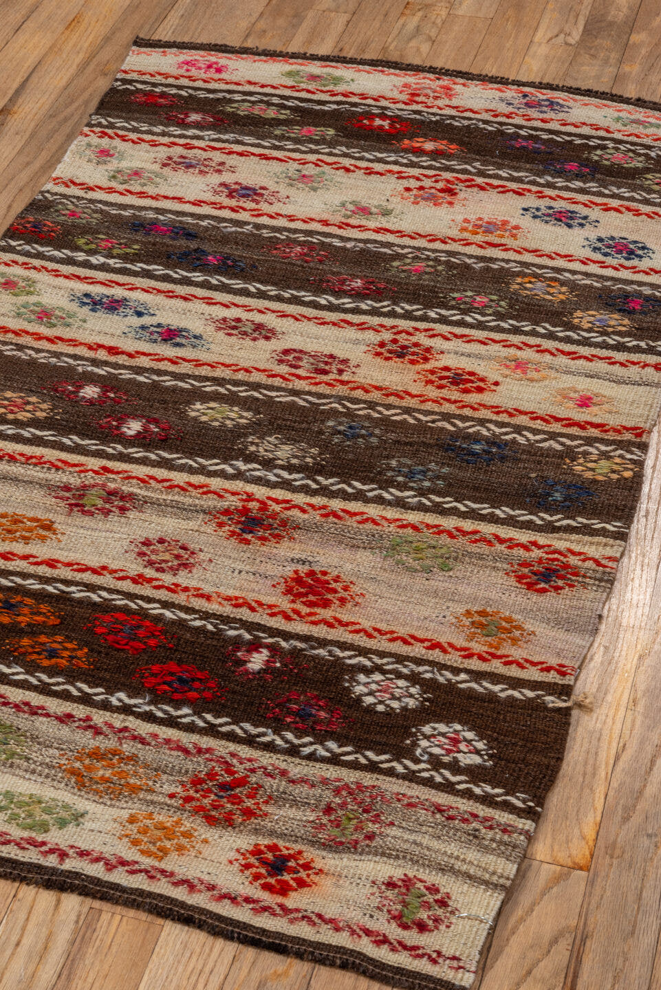 2' x 3' one-of-a-kind handmade vintage Jijim small size rug. Color palette: ivory, brown, rust, crimson, blue, olive, orange