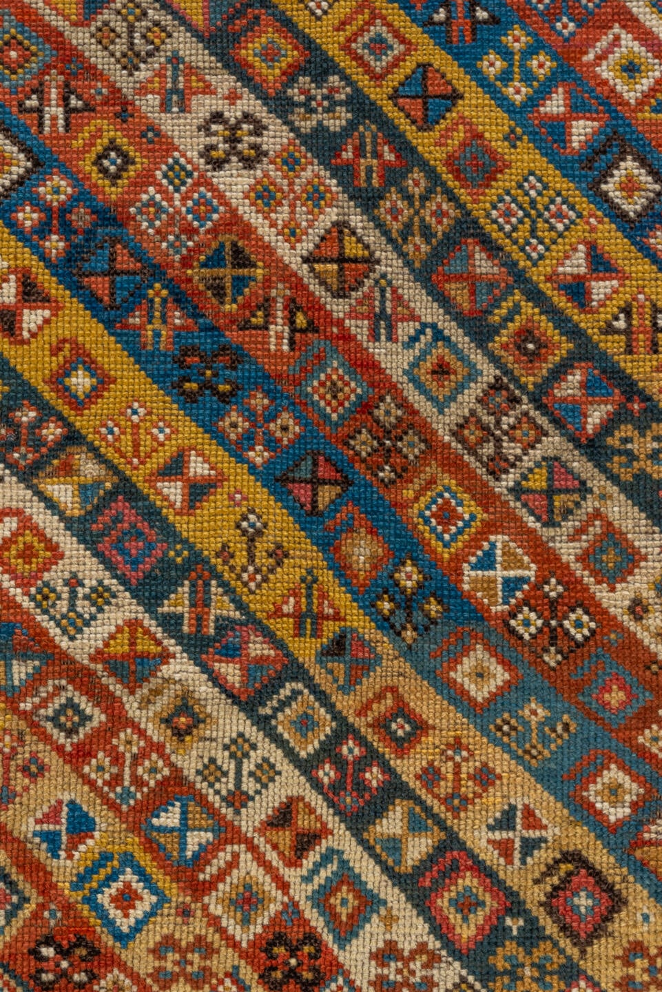 3' x 4' one-of-a-kind handmade antique Kazak small size rug. Color palette: ivory, rust, sky_blue, gold, navy, terra_cotta