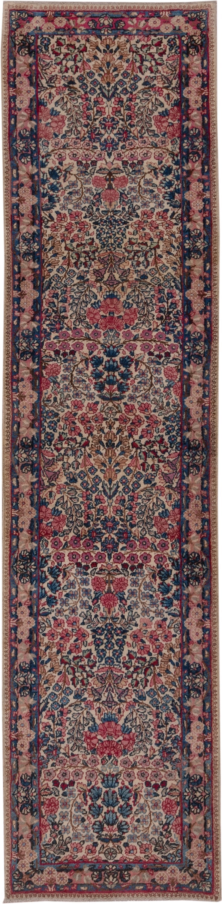2' x 10' one-of-a-kind handmade antique Kerman runner rug. Color palette: ivory, navy, rose, dusty pink, rust, taupe