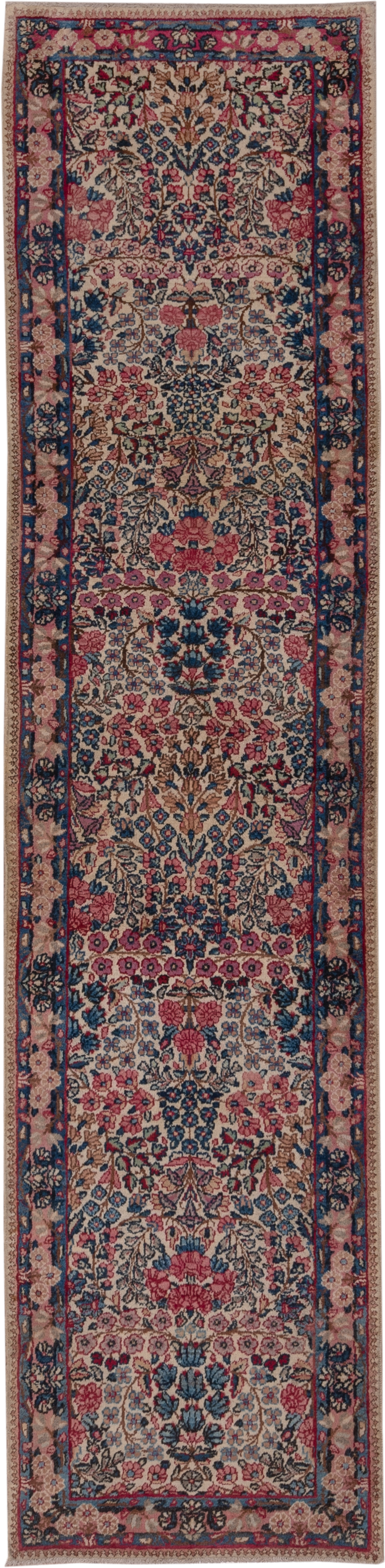 2' x 10' one-of-a-kind handmade antique Kerman runner rug. Color palette: ivory, navy, rose, dusty pink, rust, taupe