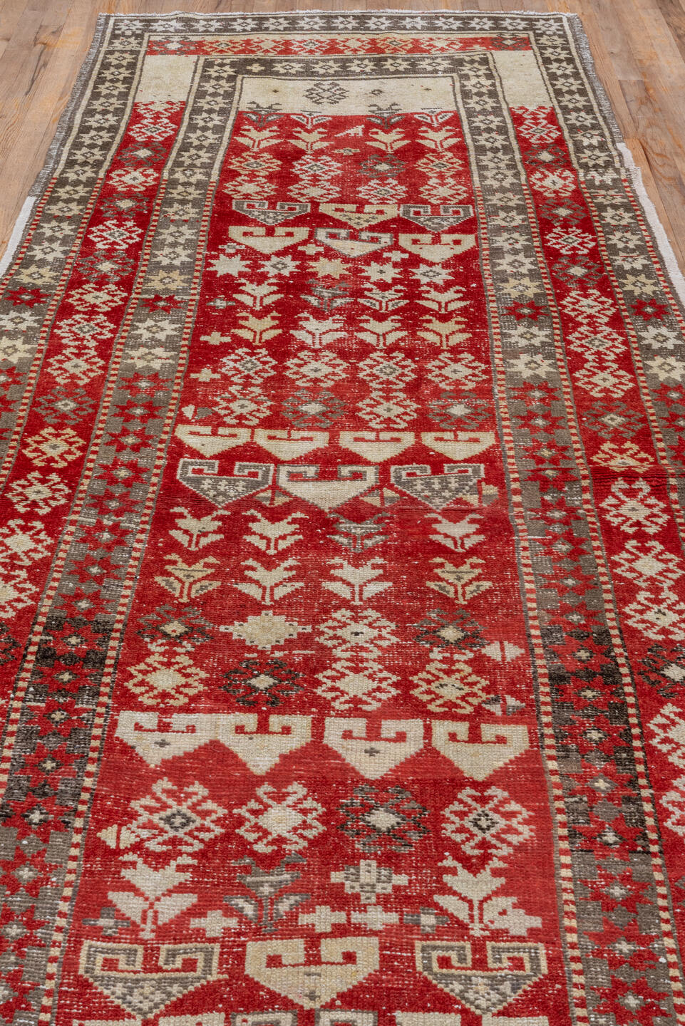 4' x 13' one-of-a-kind handmade vintage Caucasian runner rug. Color palette: brown, gray, pink, red