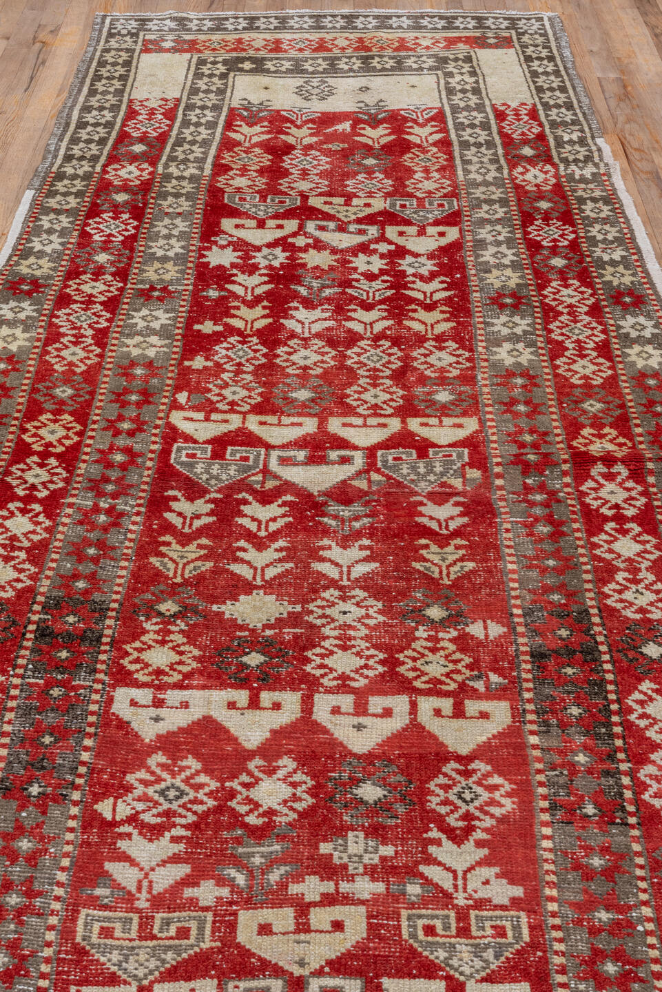 4' x 13' one-of-a-kind handmade antique Caucasian runner rug. Color palette: red, ivory, charcoal, taupe, sage, gray, black