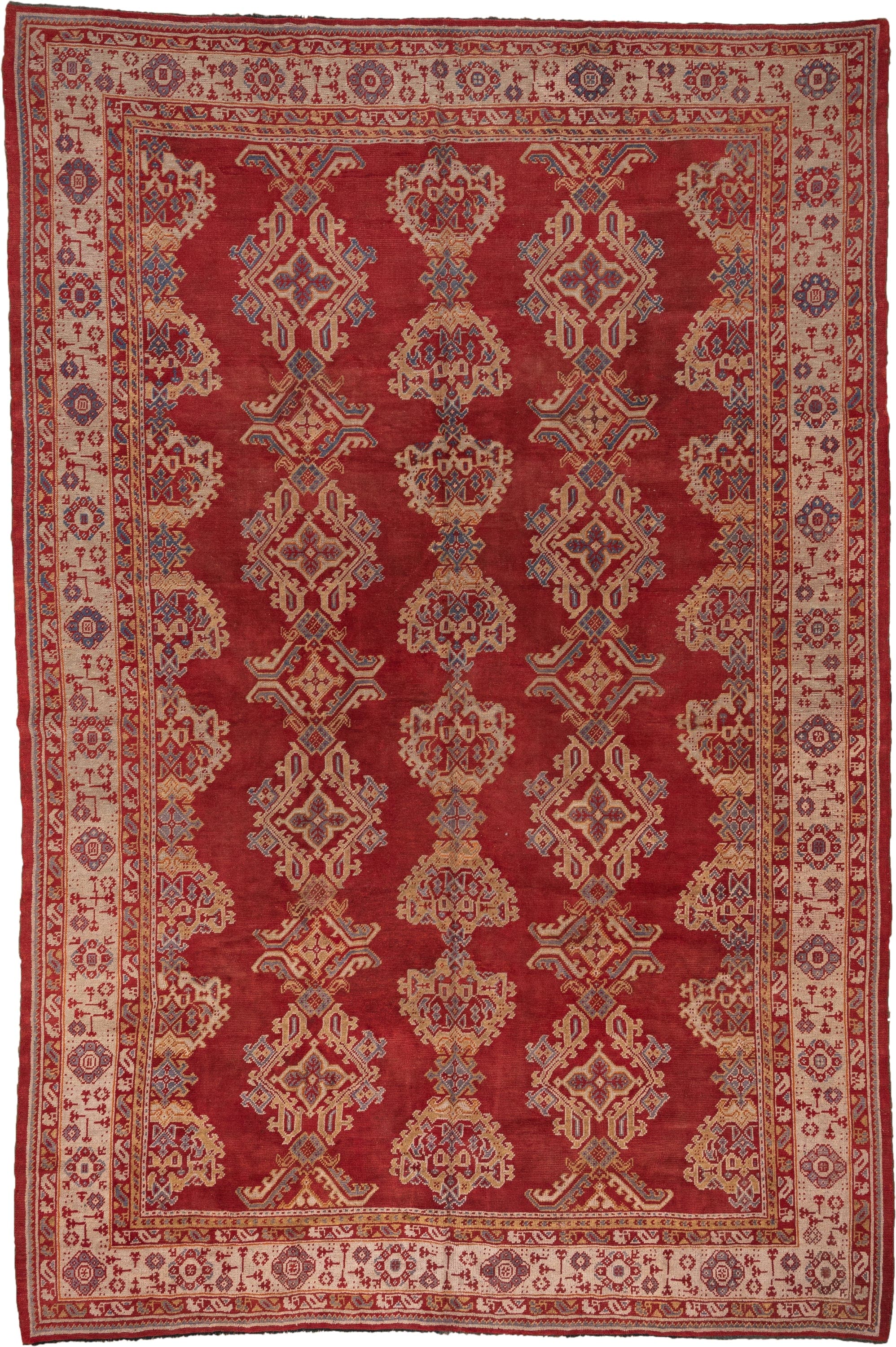 10' x 15' one-of-a-kind handmade antique Oushak rug. Color palette: rust, ivory, gold, blue, crimson, camel, terracotta