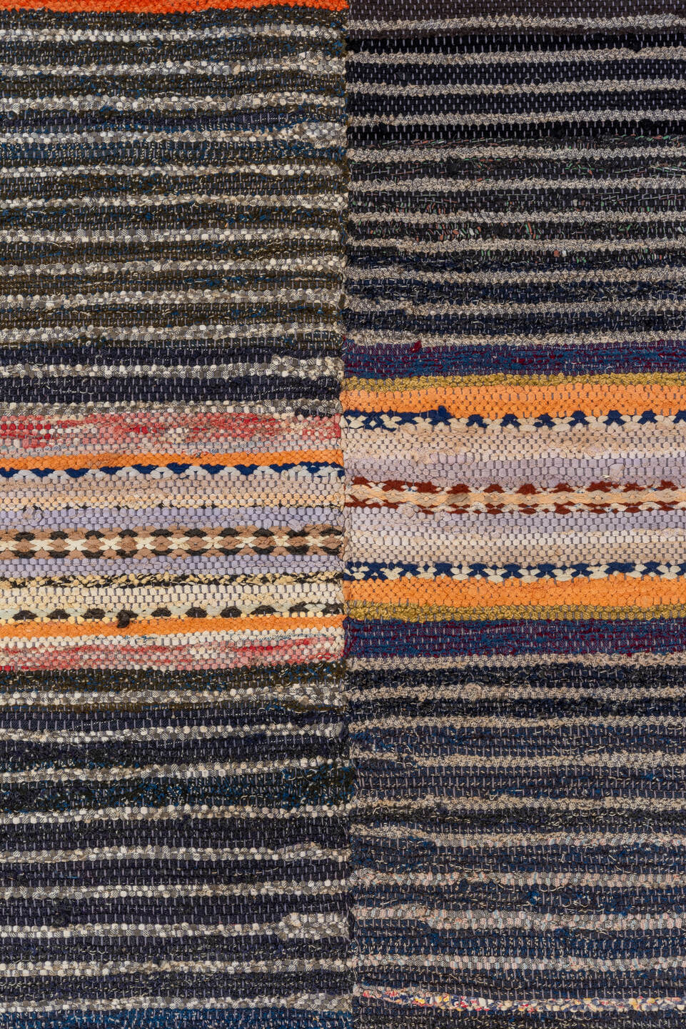 4' x 7' one-of-a-kind handmade antique Rag Rug rug. Color palette: charcoal, ivory, lavender, orange, navy, gray, peach