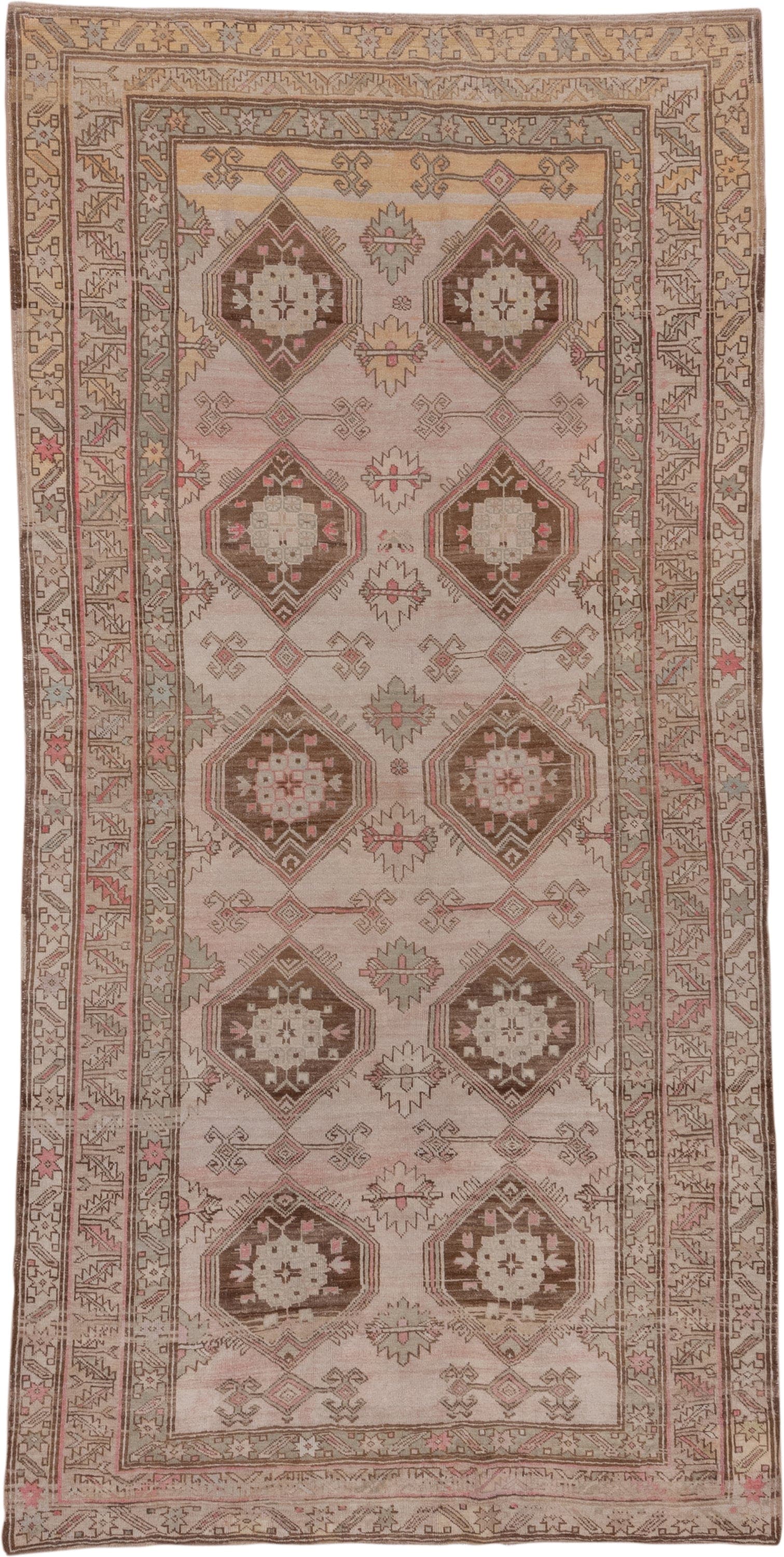 4' x 9' one-of-a-kind handmade antique Trans Caucasian runner rug. Color palette: ivory, taupe, brown, dusty_rose, camel