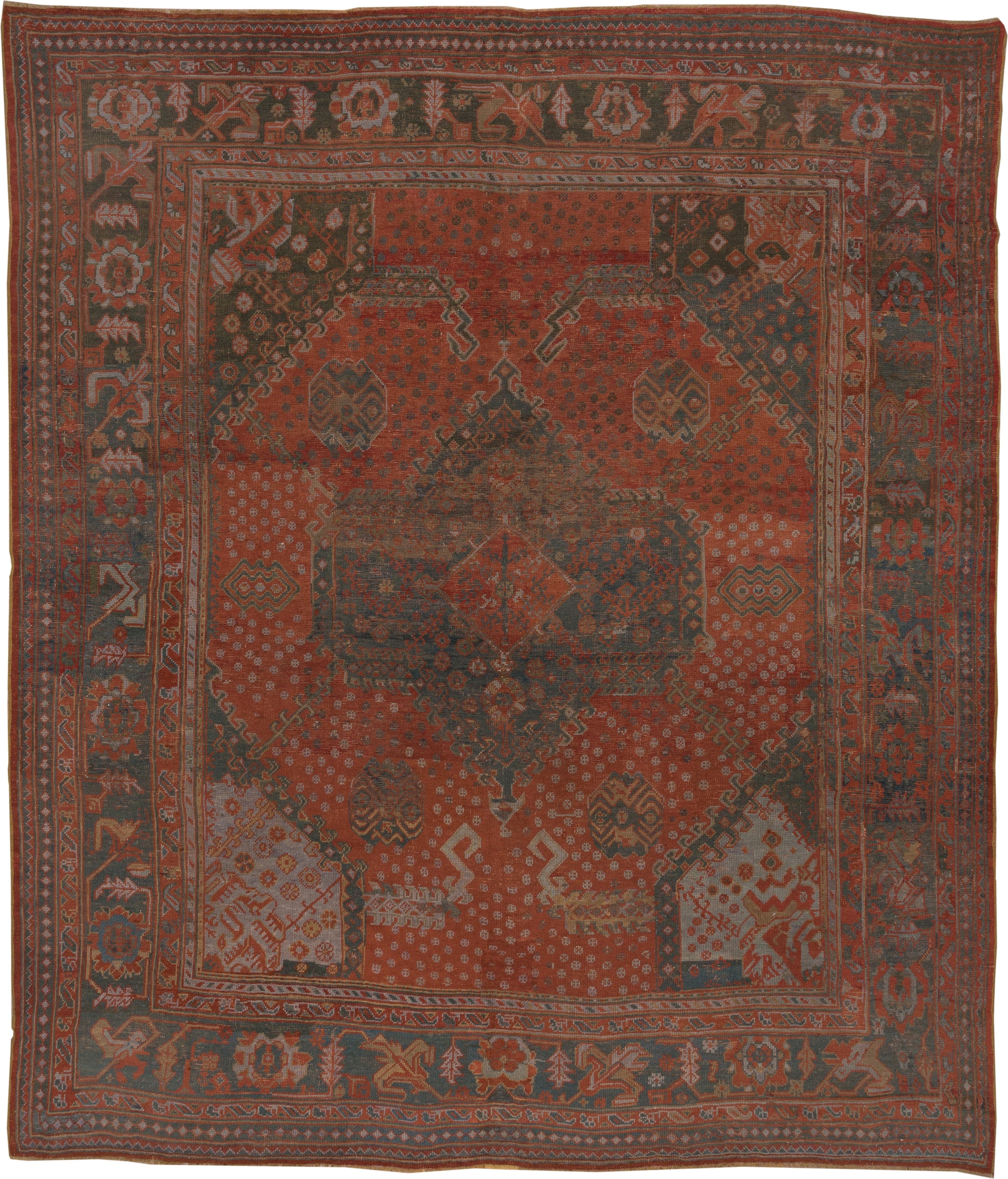 12' x 14' one-of-a-kind handmade antique Oushak oversize rug. Color palette: terra cotta, charcoal, rust, slate, ivory, rose