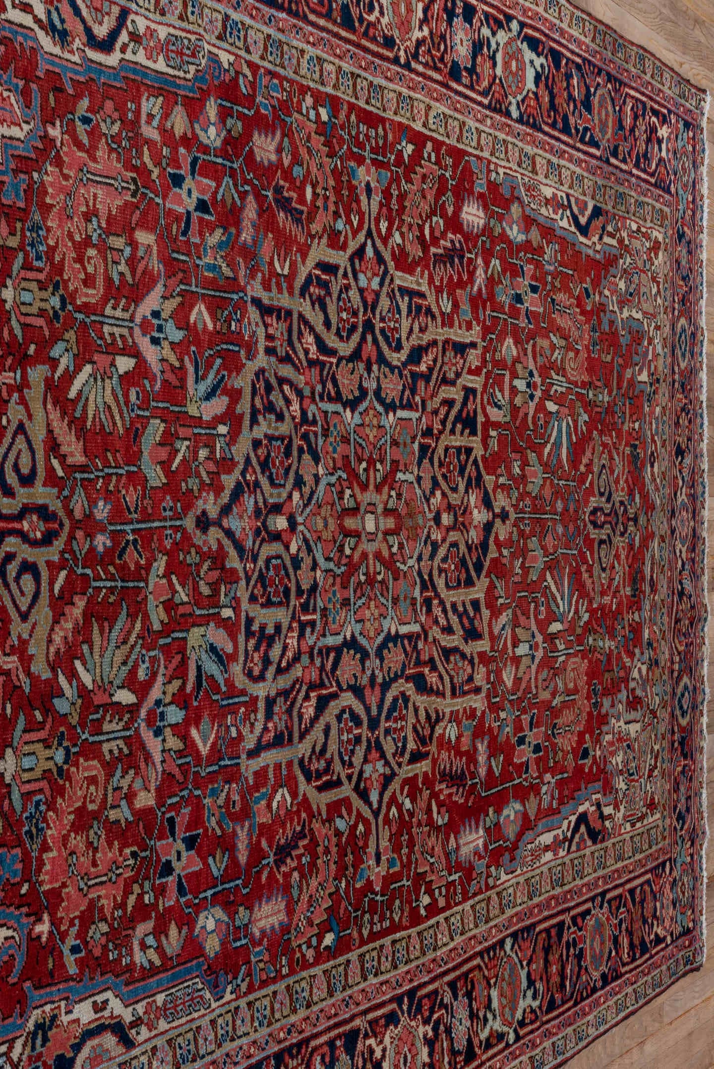 7' x 10' one-of-a-kind handmade antique Heriz large size rug. Color palette: red, navy, ivory, sky blue, rose, burgundy