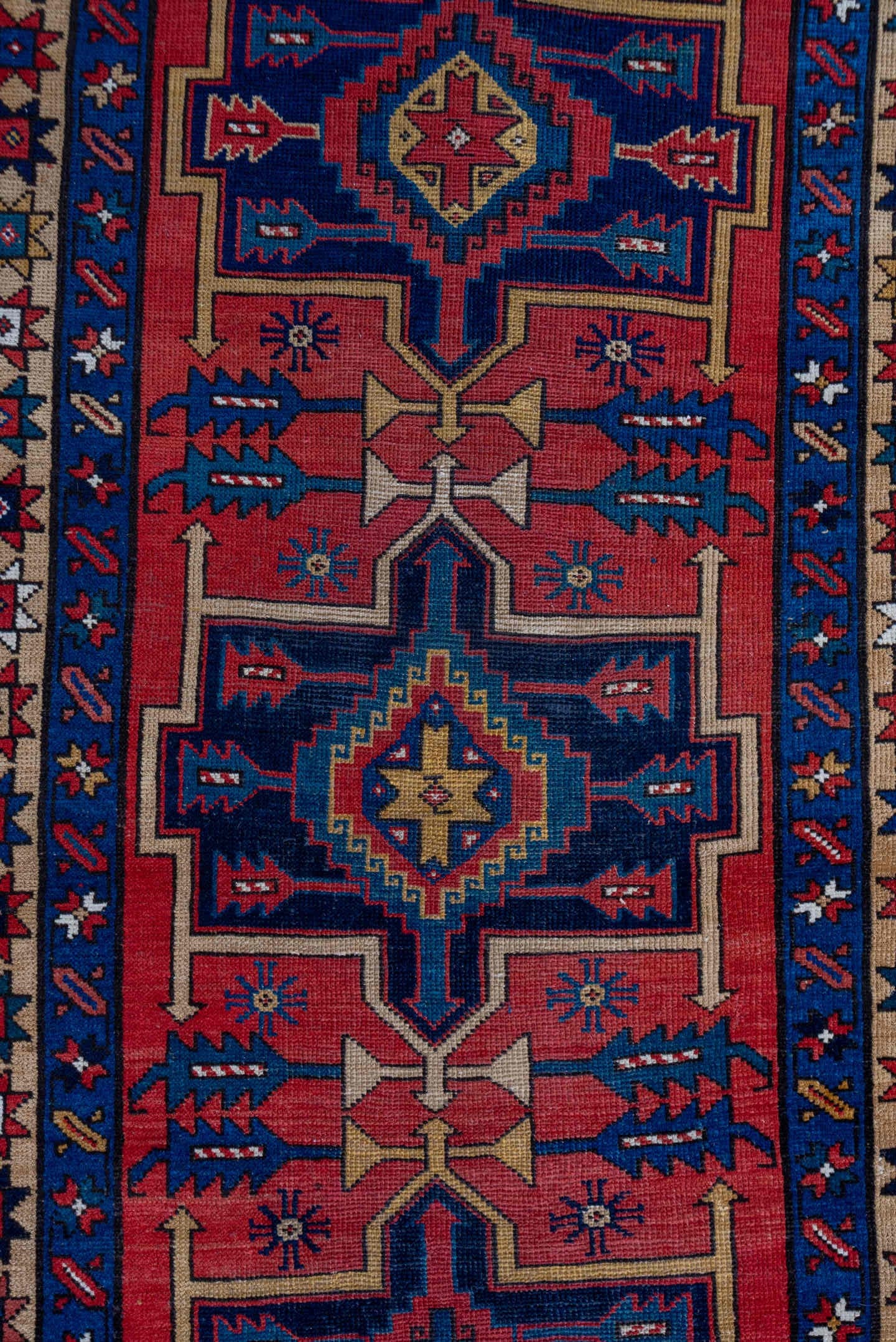 3' x 10' one-of-a-kind handmade antique Heriz runner rug. Color palette: red, navy, ivory, camel, rust, charcoal, blue