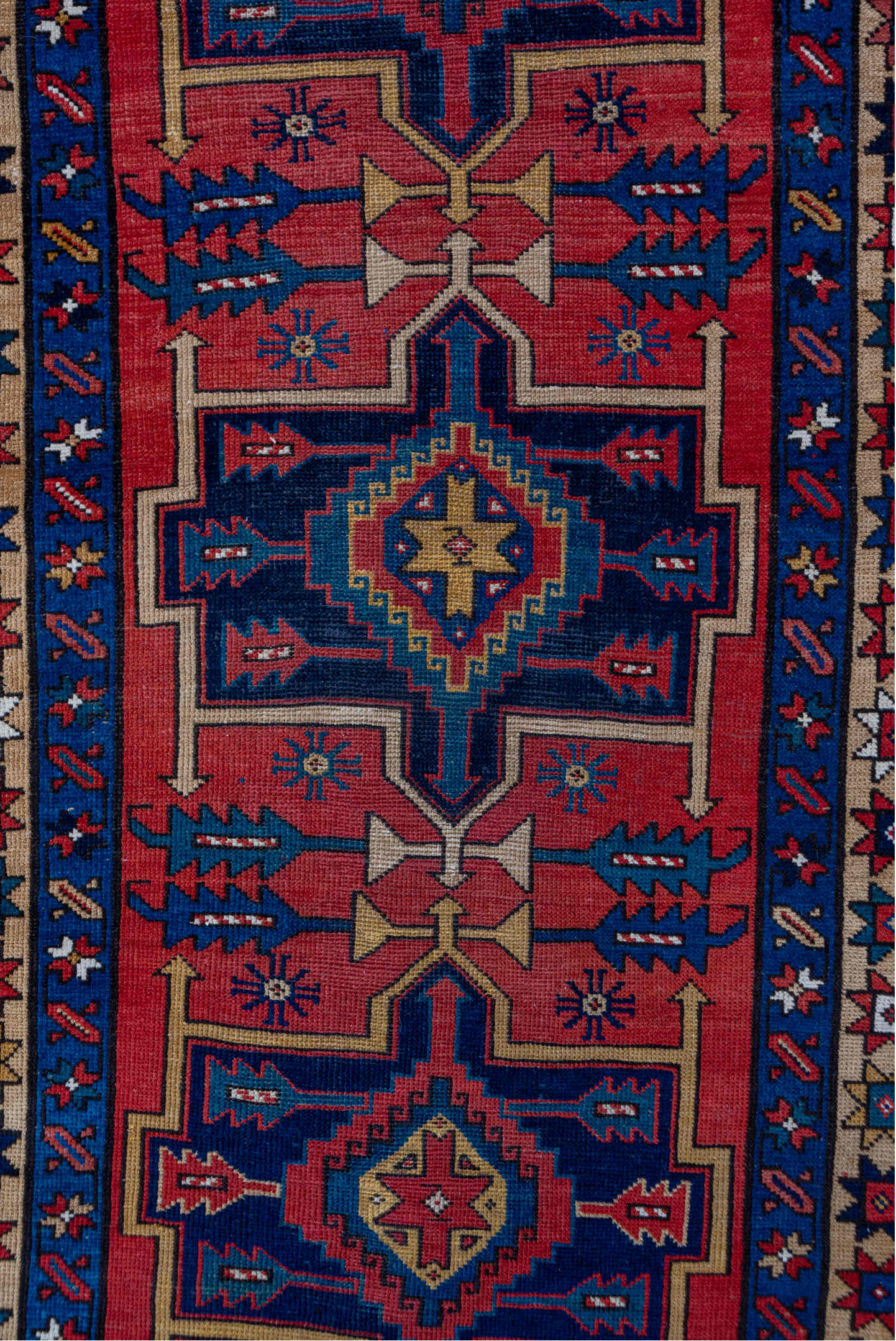 3' x 10' one-of-a-kind handmade antique Heriz runner rug. Color palette: red, navy, ivory, camel, rust, charcoal, blue