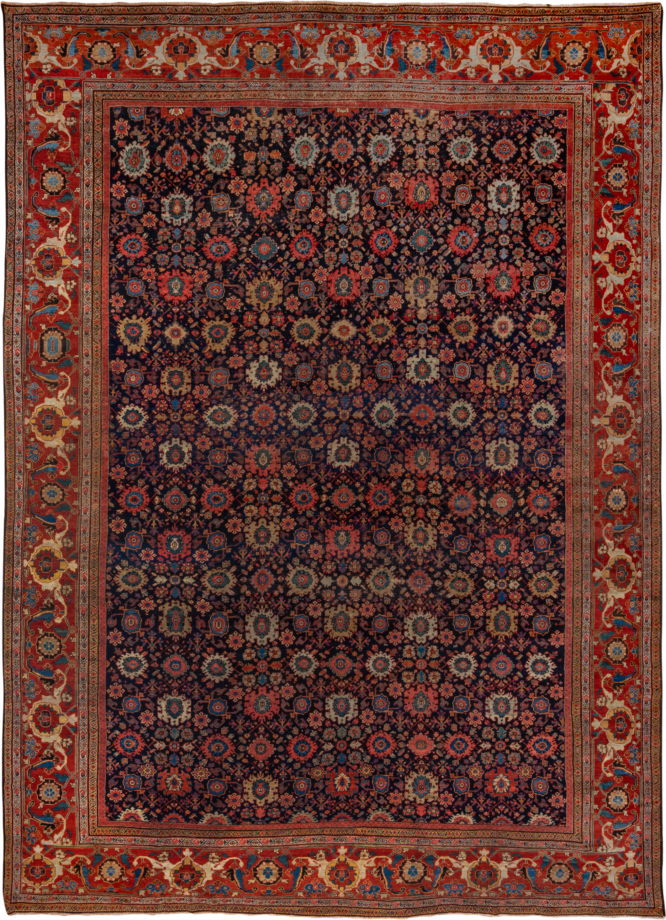 14' x 19' one-of-a-kind handmade antique Sultanabad oversize rug. Color palette: navy, rust, ivory, sky blue, terra cotta