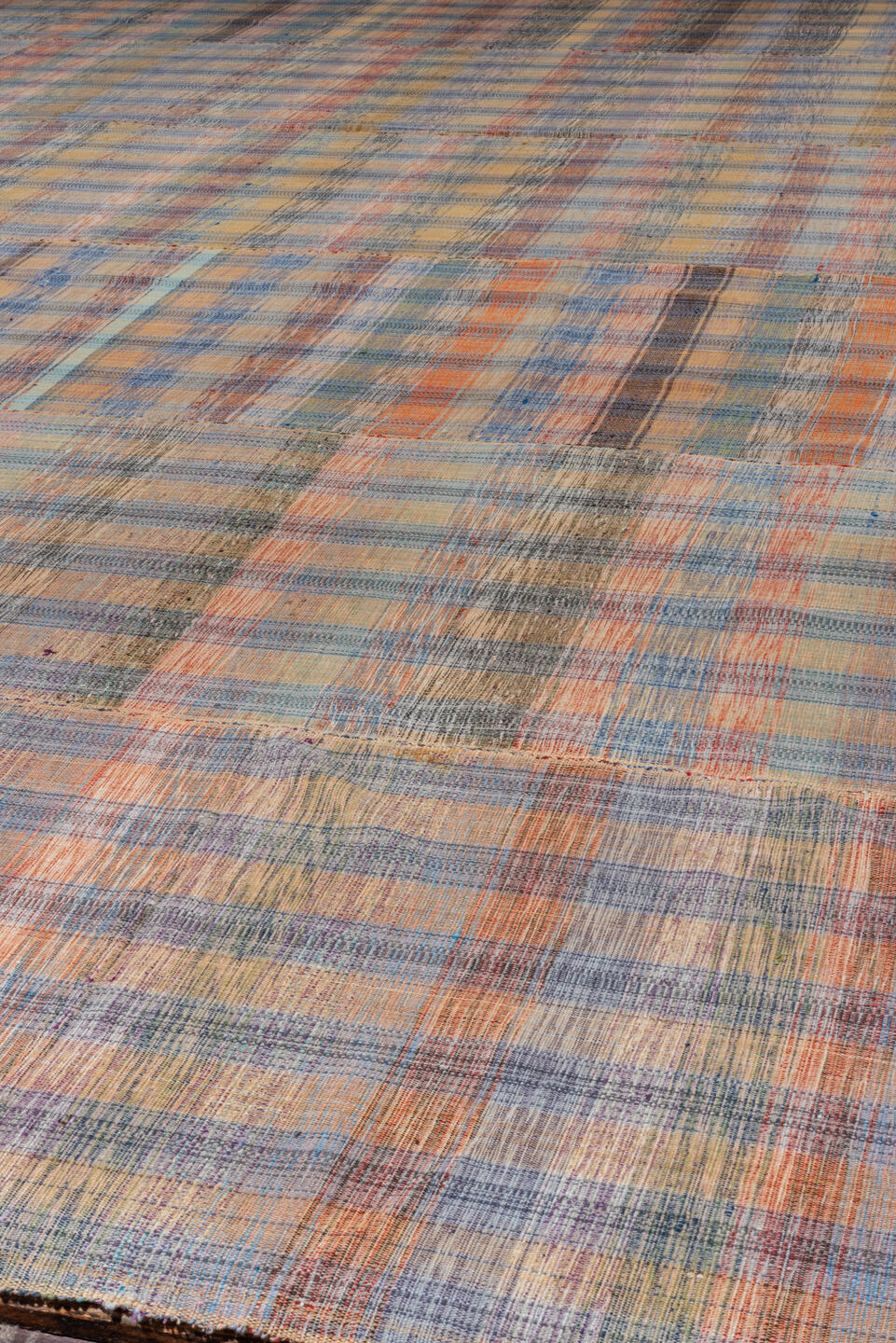 11' x 20' one-of-a-kind handmade vintage Rag Rug oversize rug. Color palette: blue, brown, dark gray, gray, pink, red