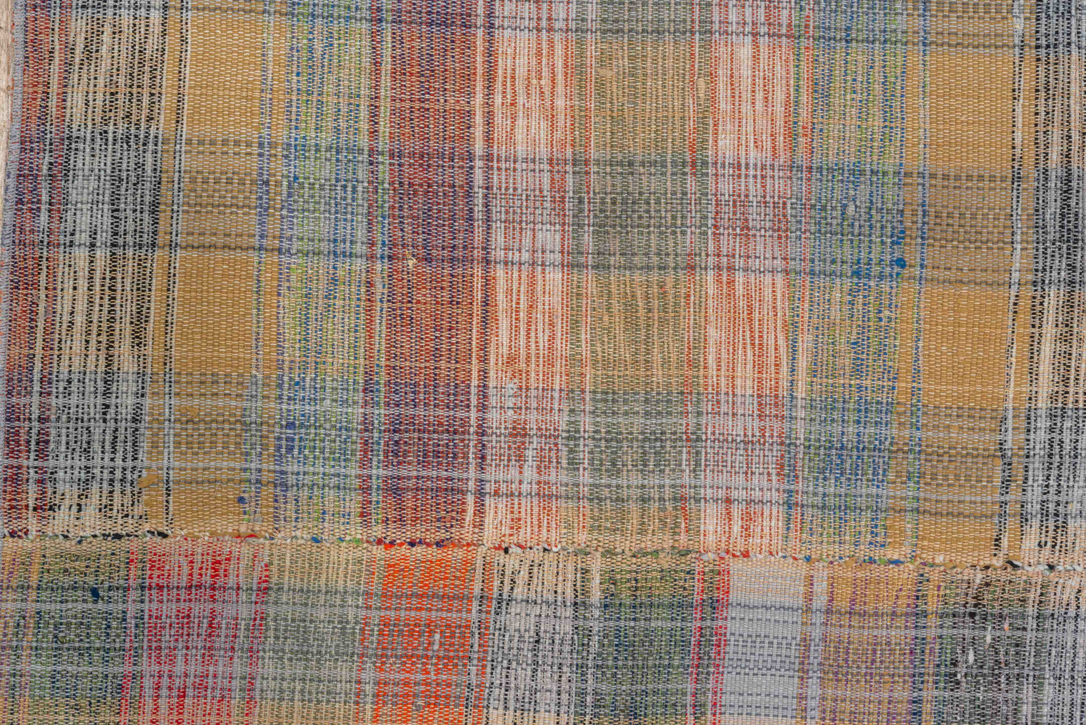 11' x 20' one-of-a-kind handmade vintage Rag Rug oversize rug. Color palette: blue, brown, dark gray, gray, pink, red