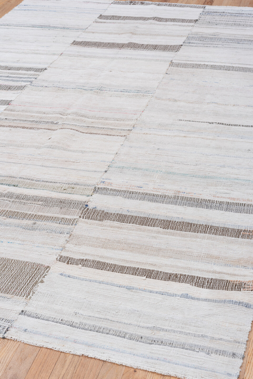 6' x 9' one-of-a-kind handmade vintage Rag Rug medium size rug. Color palette: ivory, cream, taupe, gray, pale blue, beige