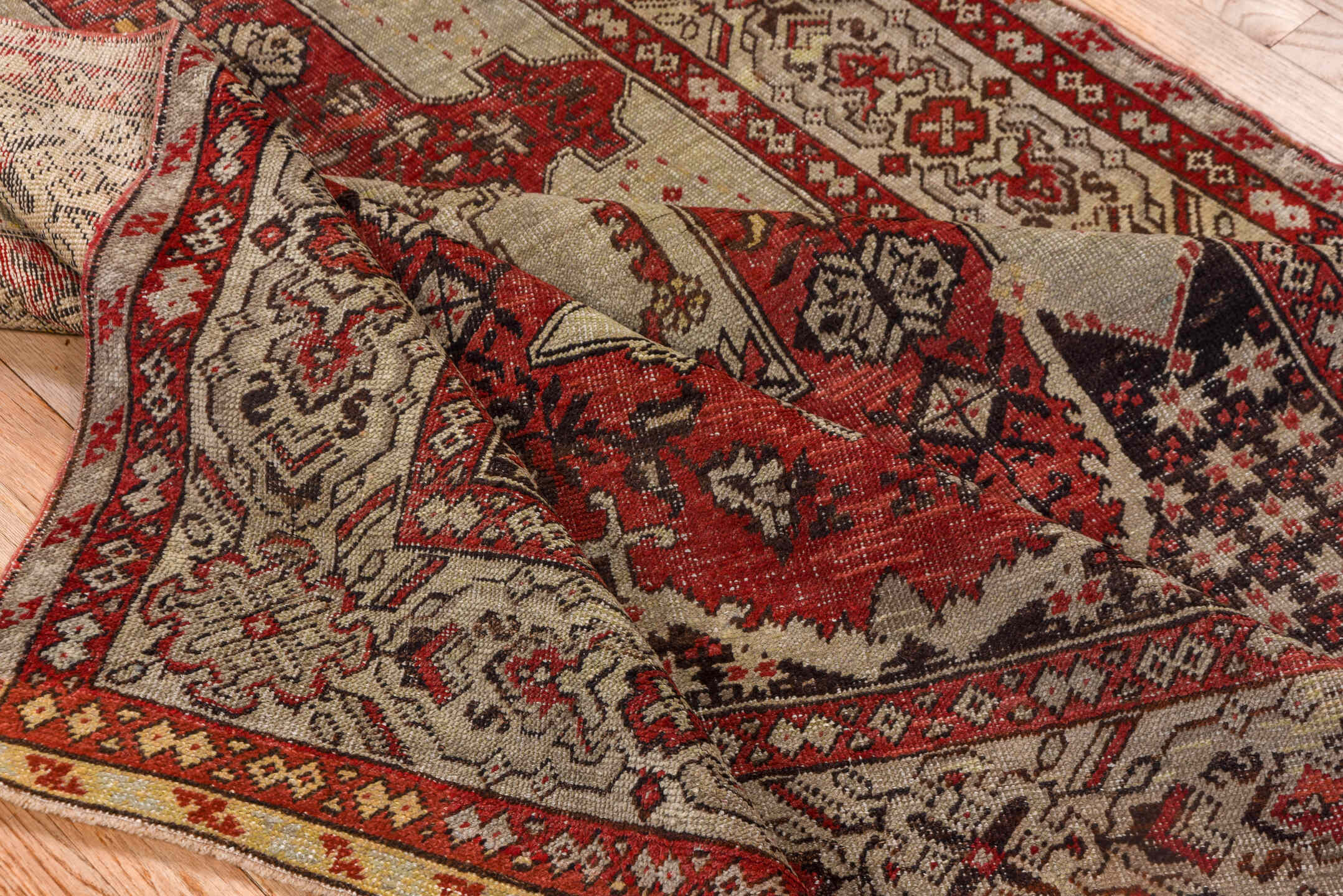 4' x 7' one-of-a-kind handmade vintage Oushak rug. Color palette: brown, gray, pink, red, redwood