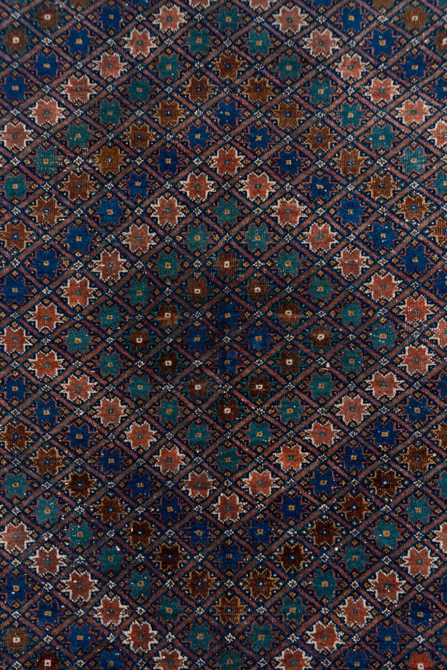 5' x 7' one-of-a-kind handmade antique Afshar rug. Color palette: navy, rust, camel, teal, ivory, rose, brown, blue
