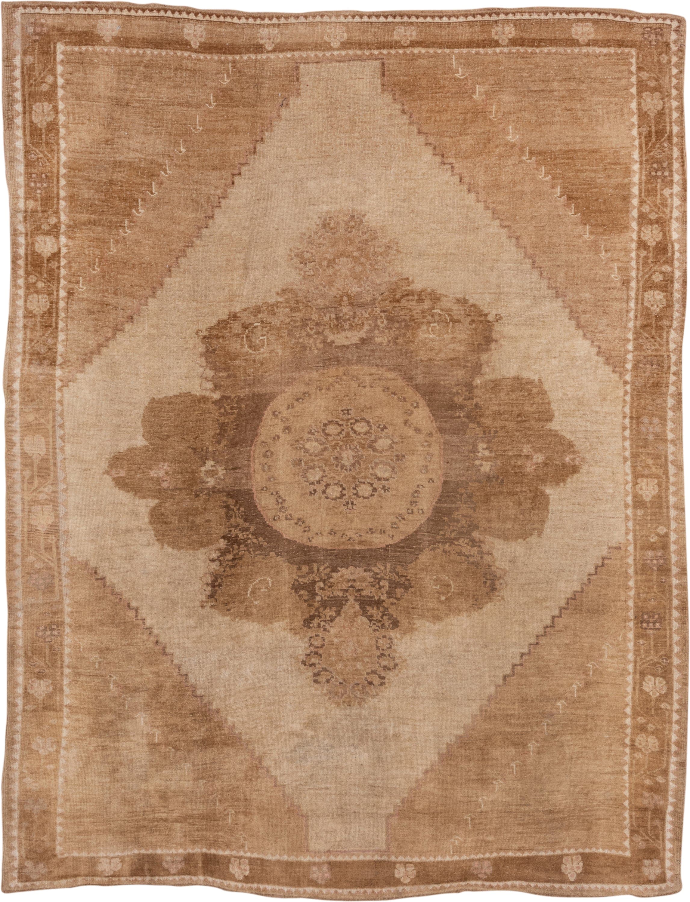 7' x 9' one-of-a-kind handmade vintage Oushak rug. Color palette: camel, ivory, taupe, beige, tan, brown, gray
