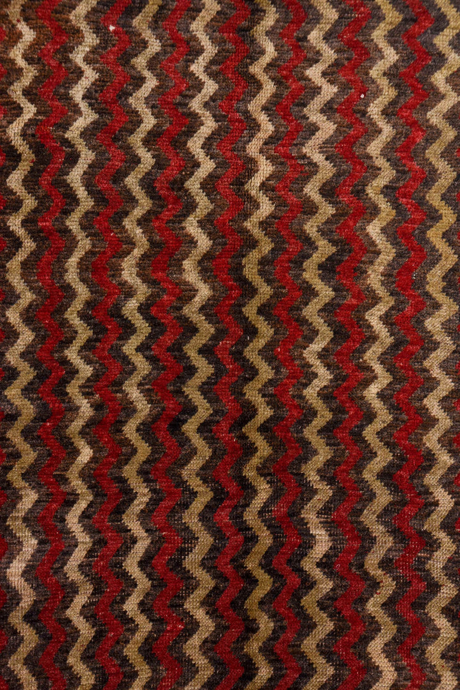 4' x 12' one-of-a-kind handmade vintage Tulu runner rug. Color palette: brown, red, taupe, charcoal, beige, gray, black