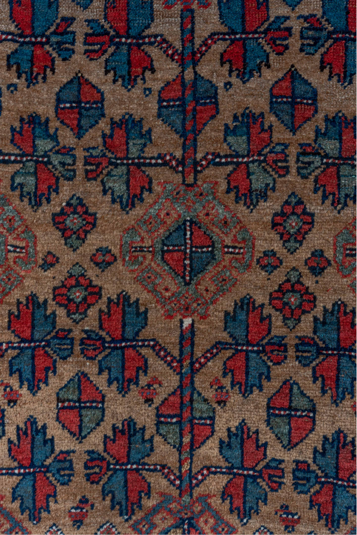 3' x 5' one-of-a-kind handmade vintage Kurd small size rug. Color palette: rust, camel, indigo, ivory, crimson, charcoal
