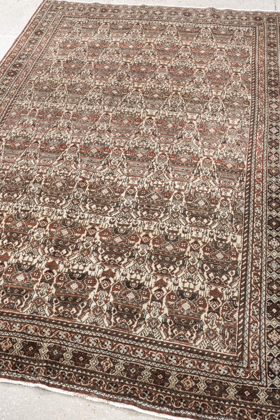 4' x 6' one-of-a-kind handmade antique Abadeh rug. Color palette: ivory, rust, brown, slate, charcoal, taupe, terracotta