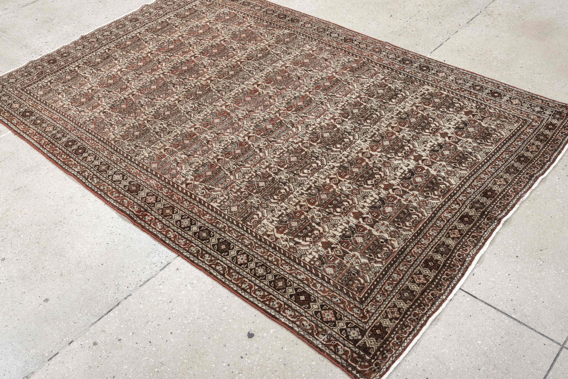 4' x 6' one-of-a-kind handmade antique Abadeh rug. Color palette: ivory, rust, brown, slate, charcoal, taupe, terracotta