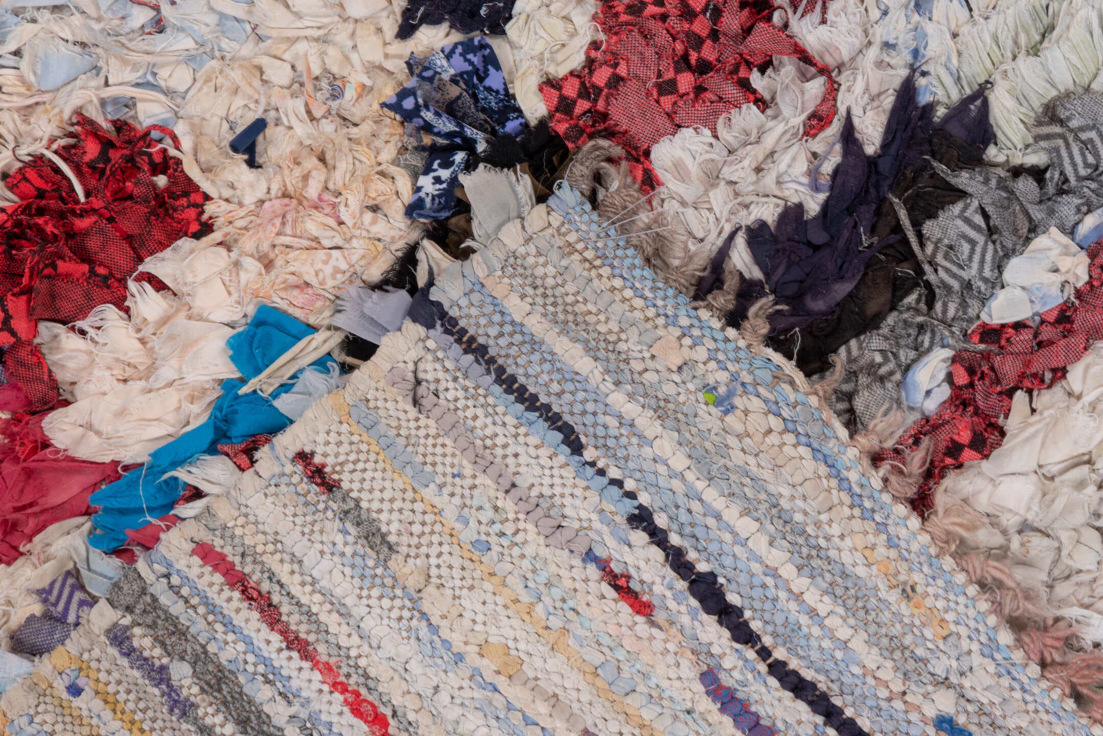 2' x 5' one-of-a-kind handmade vintage Rag Rug small size rug. Color palette: ivory, pale blue, navy, crimson, brown, violet