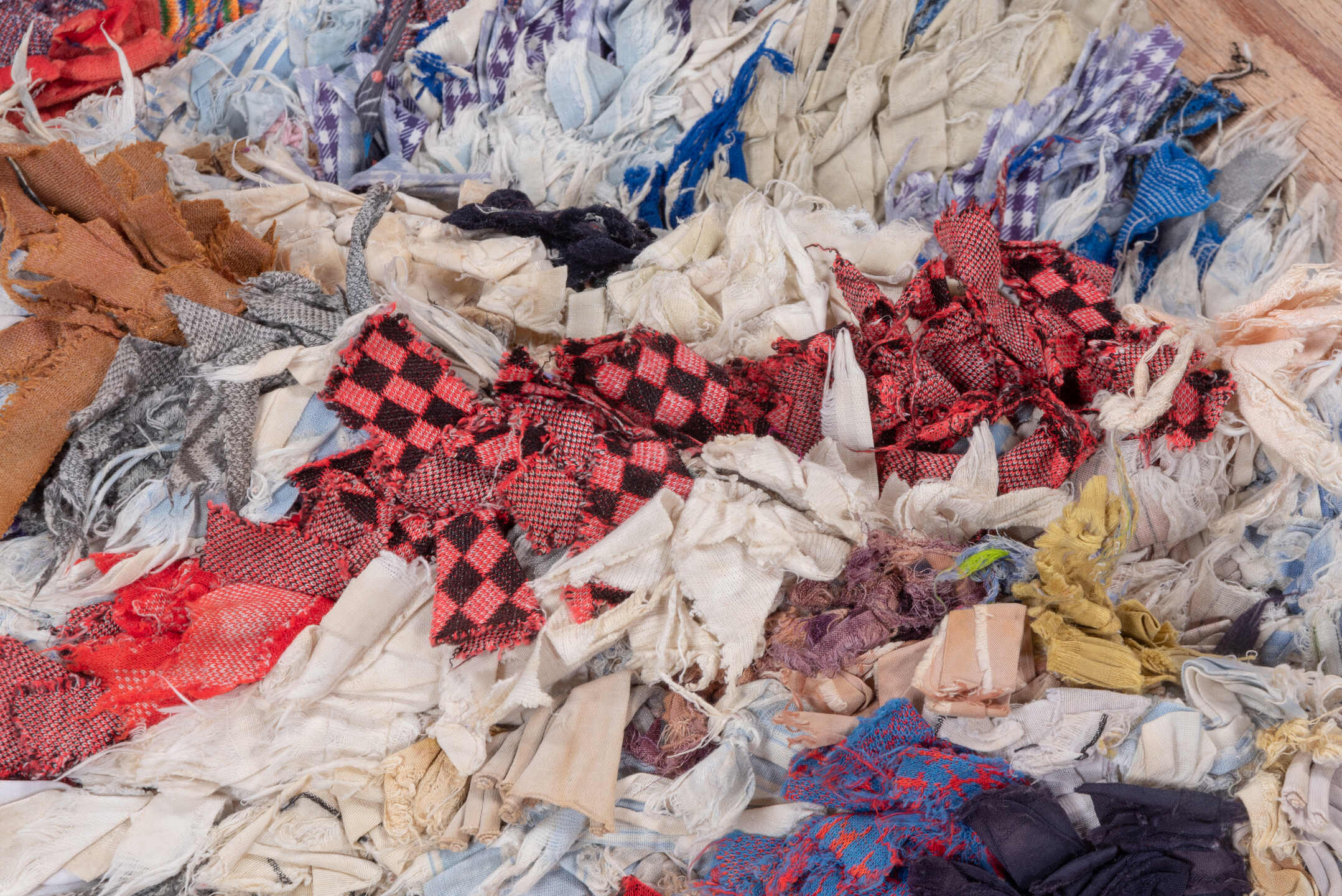 2' x 5' one-of-a-kind handmade vintage Rag Rug small size rug. Color palette: ivory, pale blue, navy, crimson, brown, violet