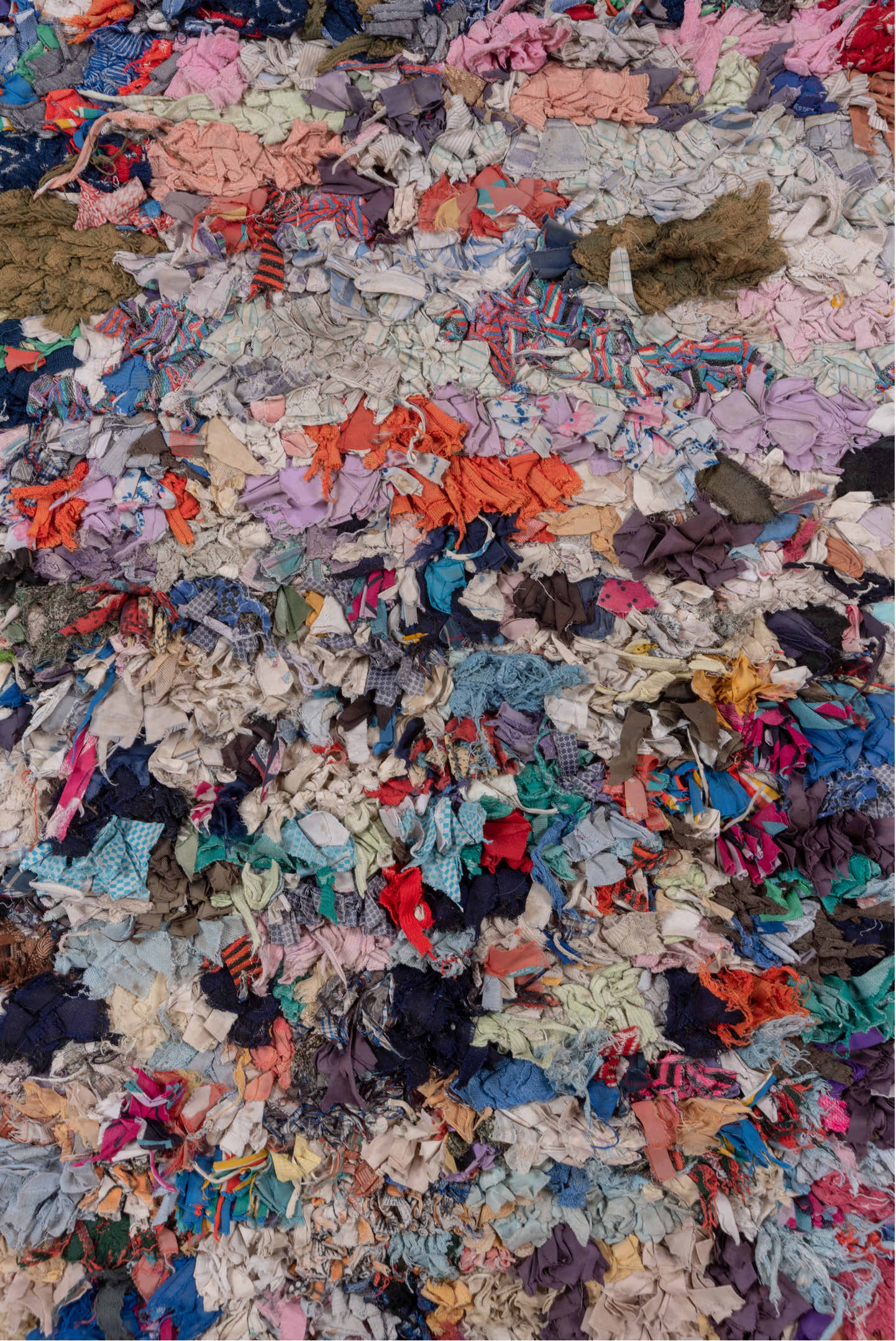 4' x 7' one-of-a-kind handmade vintage Rag Rug rug. Color palette: ivory, gray, blue, pink, purple, red, yellow, charcoal