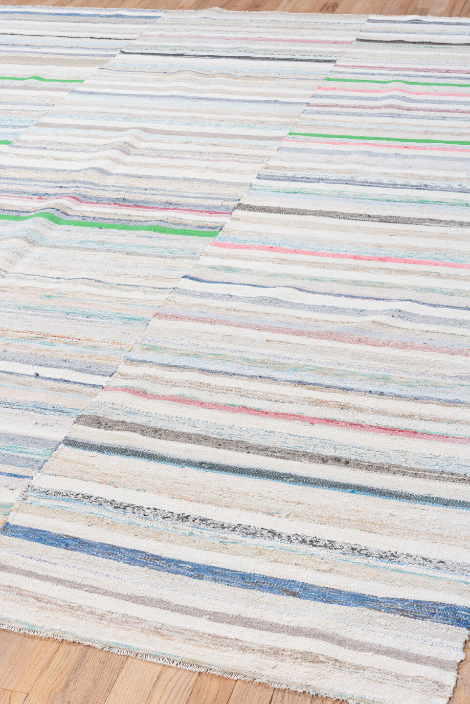 7' x 10' one-of-a-kind handmade vintage Rag Rug large size rug. Color palette: ivory, pale blue, beige, charcoal, pink