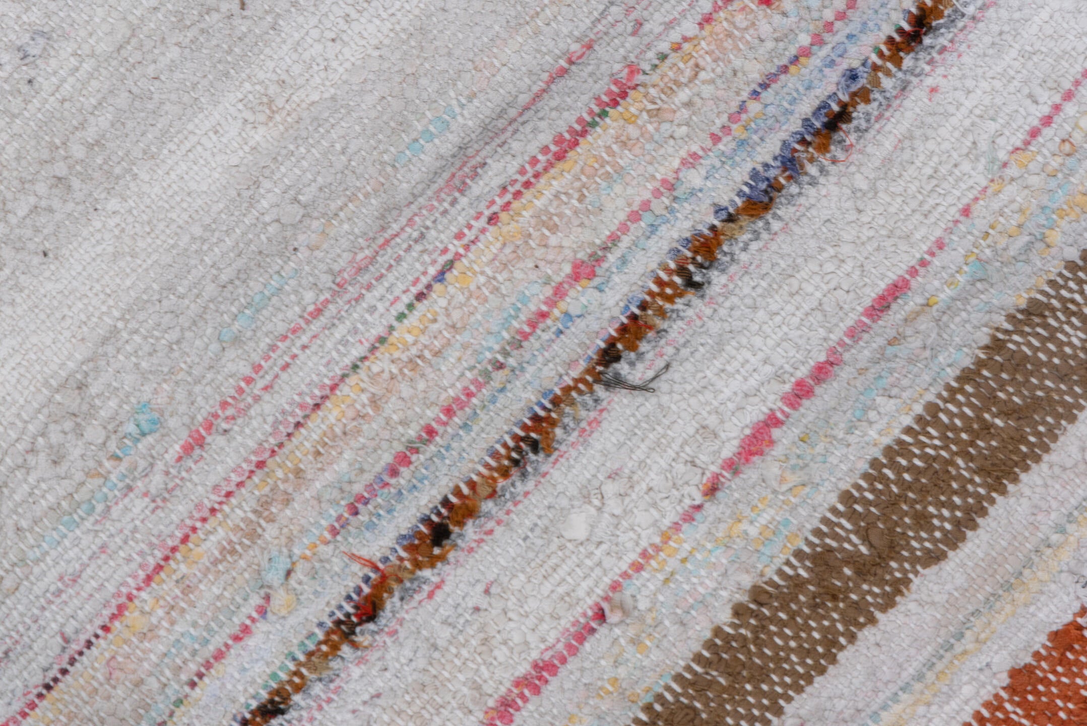 7' x 8' one-of-a-kind handmade antique Rag Rug rug. Color palette: ivory, rose, pale blue, peach, gray, tan, pink, red