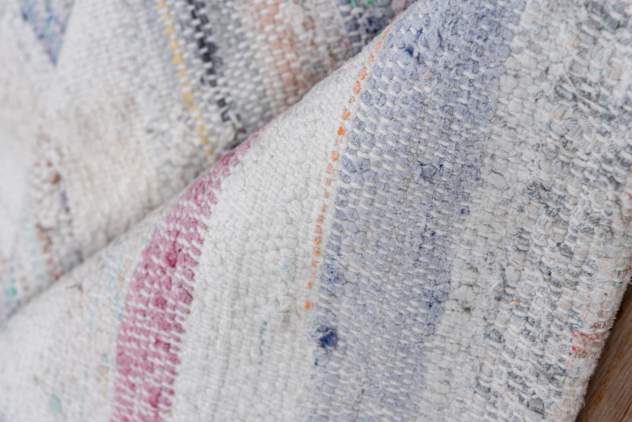 7' x 8' one-of-a-kind handmade antique Rag Rug rug. Color palette: ivory, rose, pale blue, peach, gray, tan, pink, red