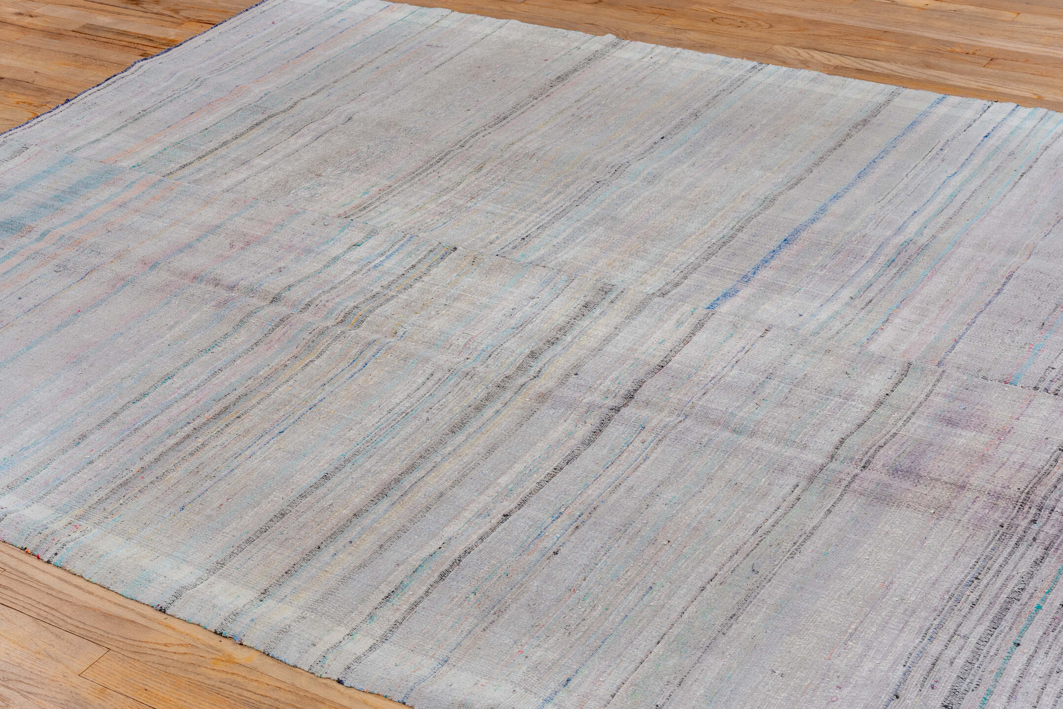 6' x 9' one-of-a-kind handmade antique Rag Rug medium size rug. Color palette: gray, lavender, sky_blue, blush, charcoal