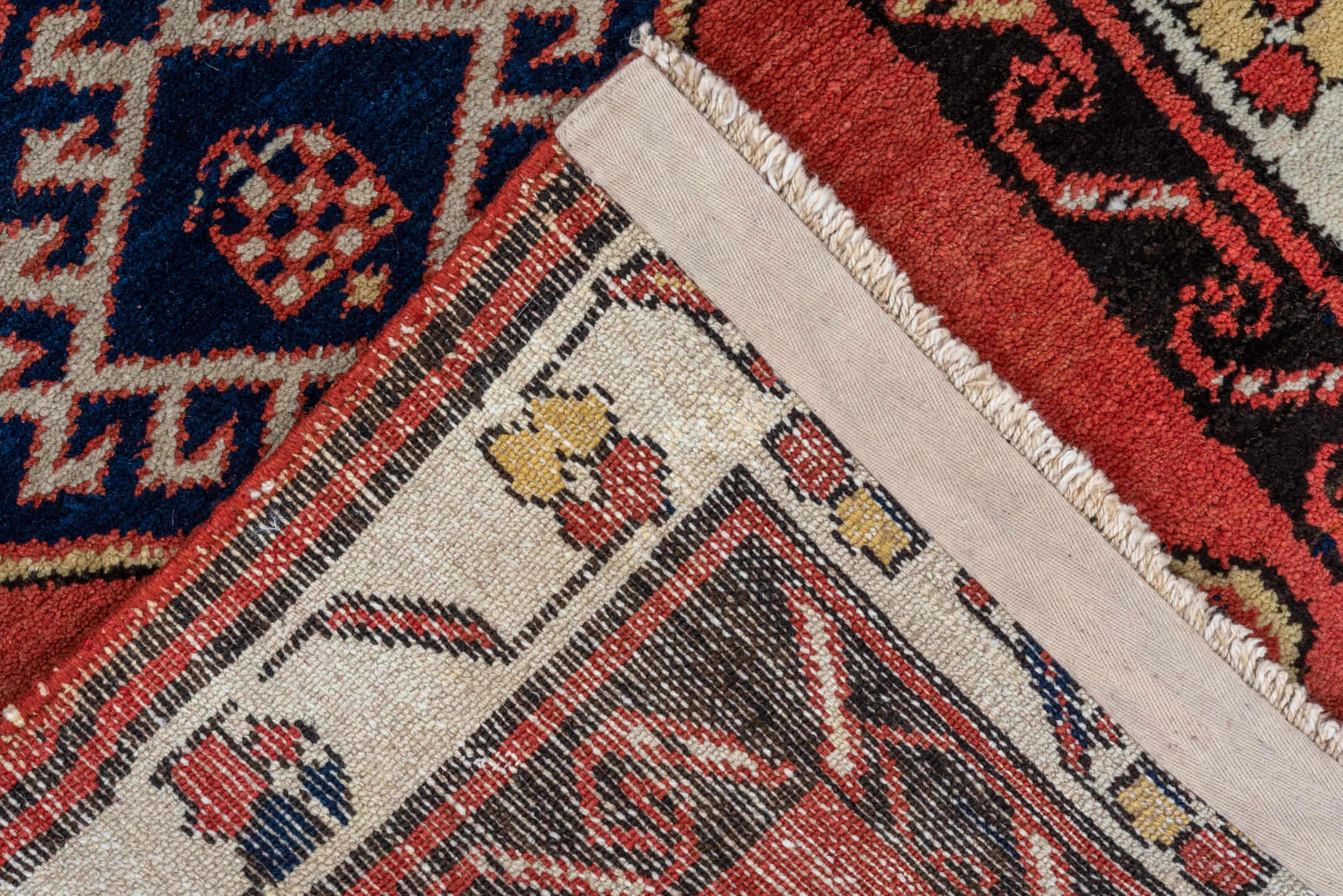 2' x 9' one-of-a-kind handmade antique Sarab runner rug. Color palette: terra cotta, ivory, navy, rust, charcoal, camel