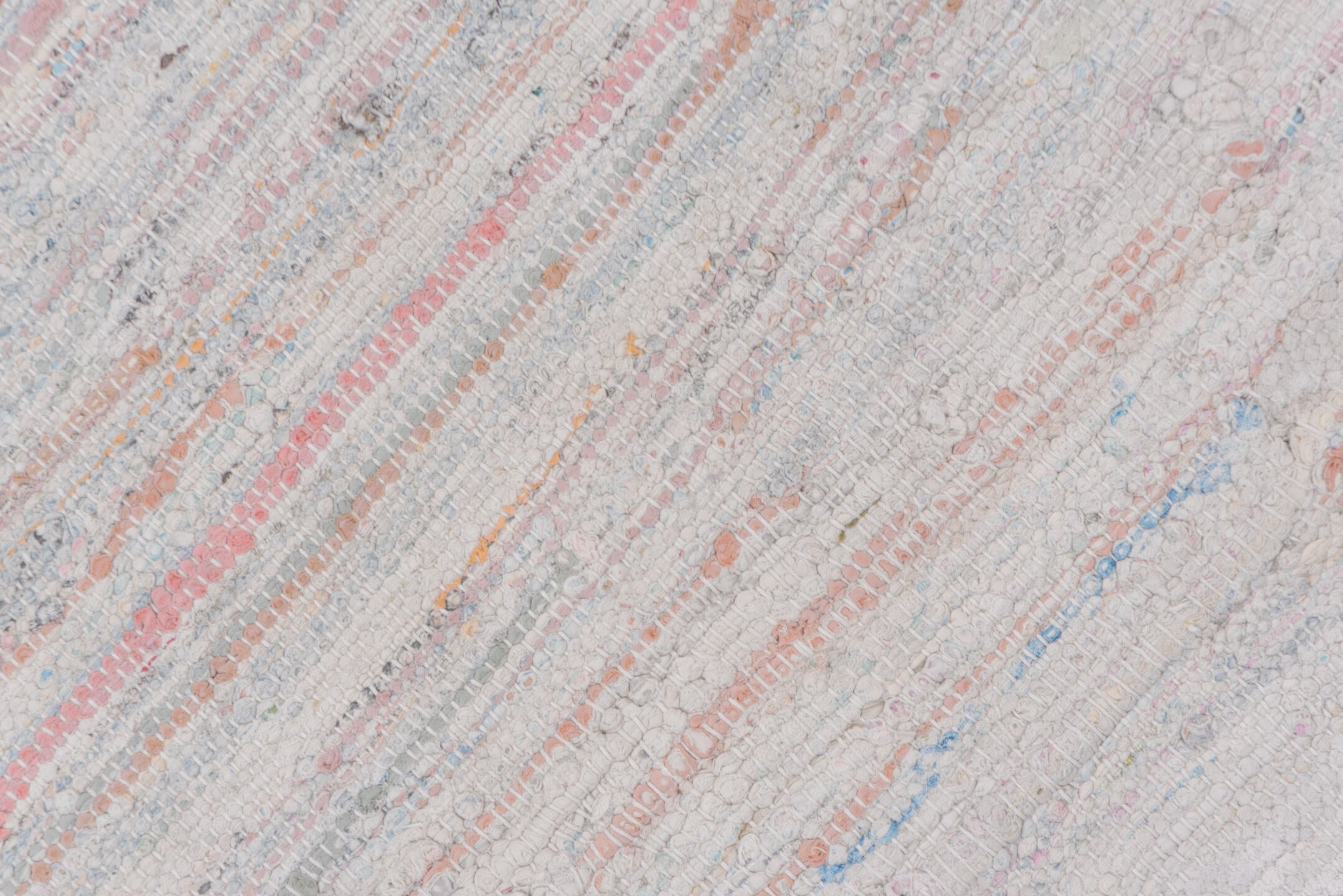5' x 7' one-of-a-kind handmade antique Rag Rug rug. Color palette: ivory, blush, pale blue, peach, taupe, pink, light blue