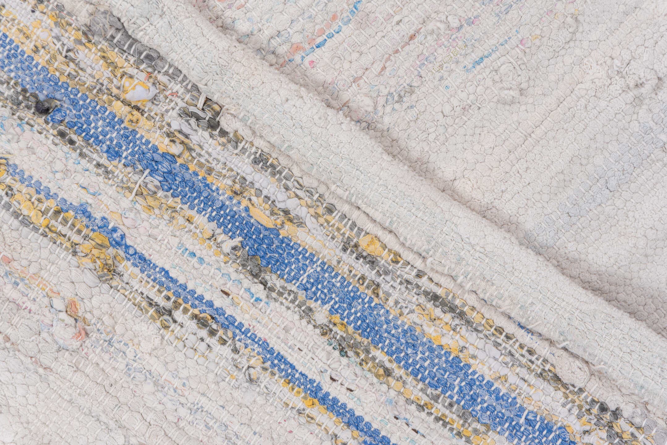 5' x 7' one-of-a-kind handmade antique Rag Rug rug. Color palette: ivory, blush, pale blue, peach, taupe, pink, light blue