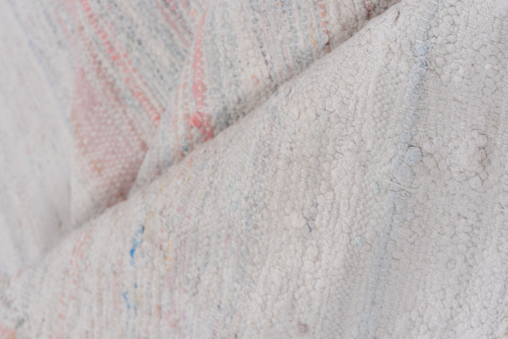 5' x 7' one-of-a-kind handmade antique Rag Rug rug. Color palette: ivory, blush, pale blue, peach, taupe, pink, light blue