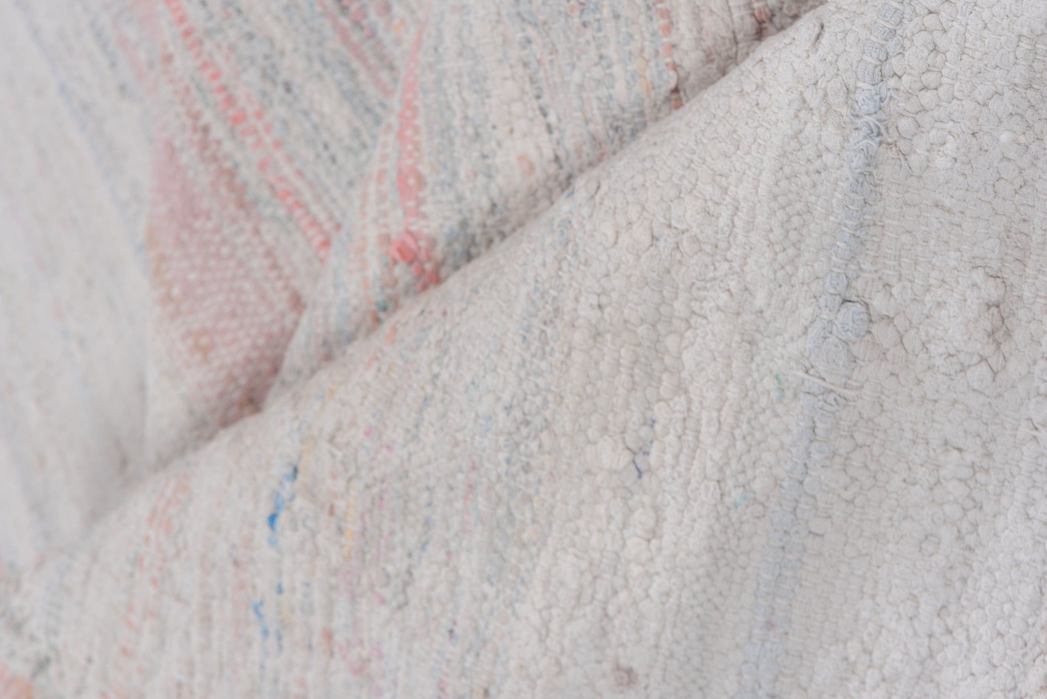 5' x 7' one-of-a-kind handmade antique Rag Rug rug. Color palette: ivory, blush, pale blue, peach, taupe, pink, light blue