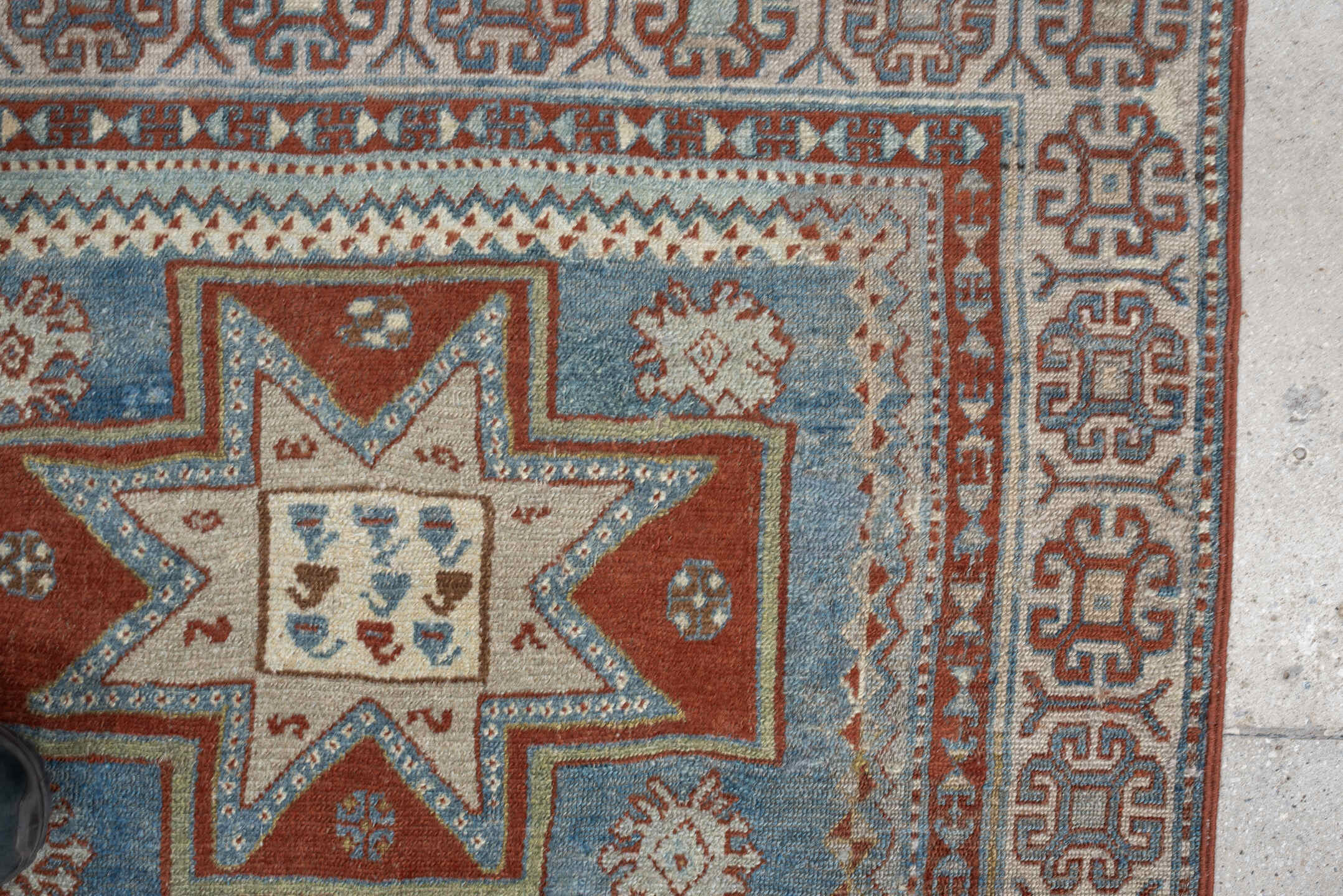 3' x 4' one-of-a-kind handmade antique Caucasian small size rug. Color palette: ivory, sky blue, rust, terra cotta, camel