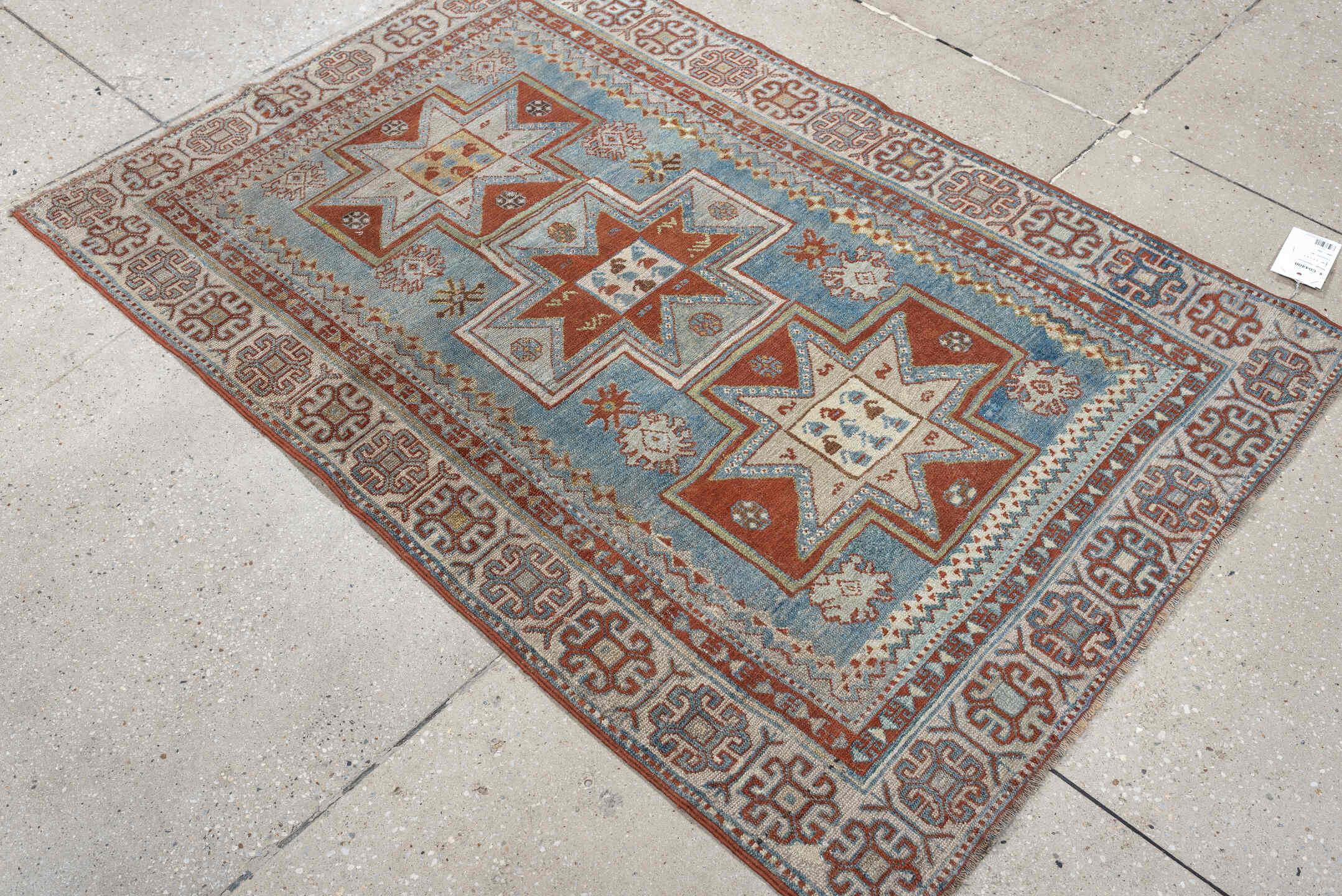 3' x 4' one-of-a-kind handmade antique Caucasian small size rug. Color palette: ivory, sky blue, rust, terra cotta, camel